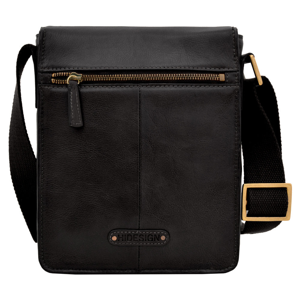 The Aiden Genuine Leather Mini Crossbody by Hidesign is a brown leather shoulder bag featuring a flap cover and an adjustable fabric strap with a brass buckle.