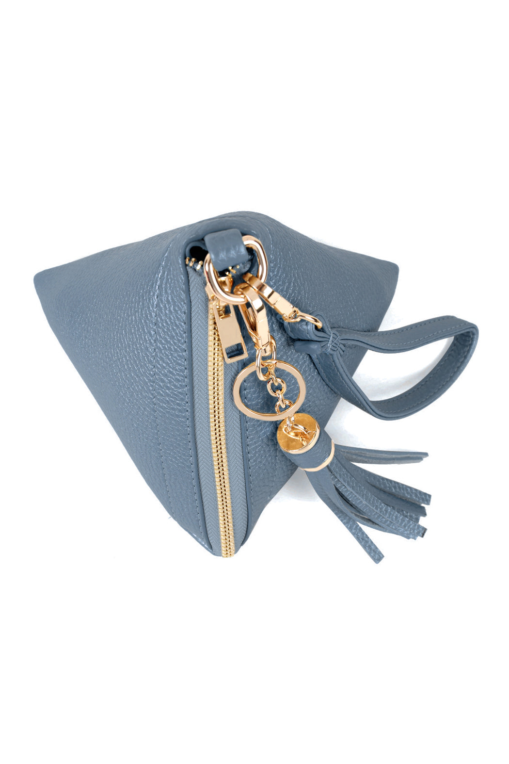 A person in a white shirt and jeans is holding the Riah Fashion Pyramid Shape Tassel Wristlet Leather Bag in orange.