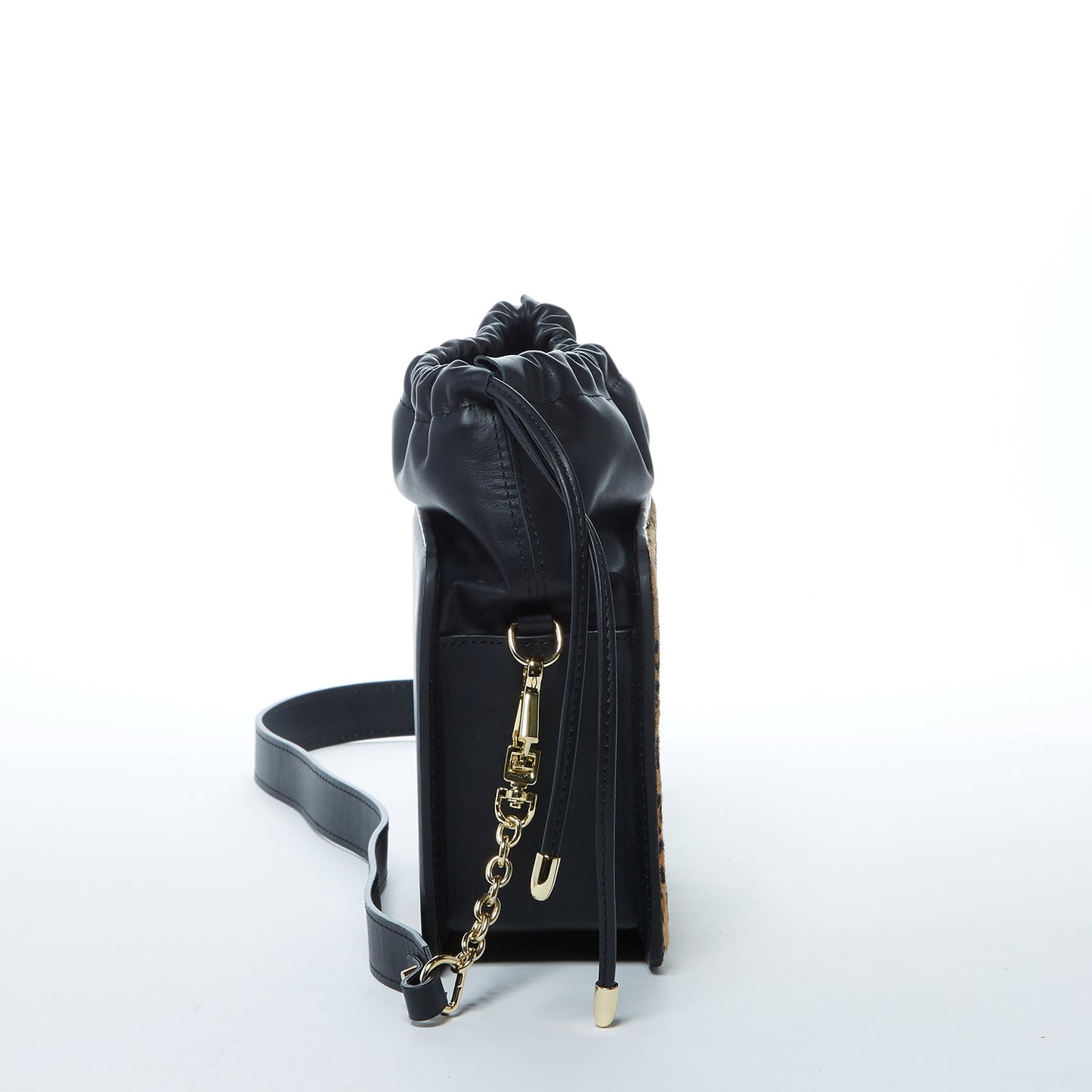 The Patricia Black Leopard Leather Purse by SUSU features a leopard print, black leather accents, drawstring closure, detachable strap, and gold hardware.