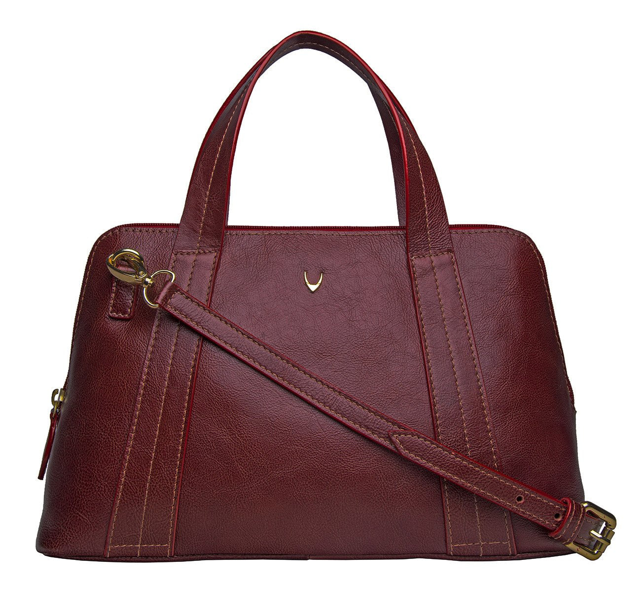 The Cerys Medium Leather Satchel by Hidesign is a red handbag with short handles and a detachable shoulder strap, featuring gold-tone hardware and a small gold emblem on the front.