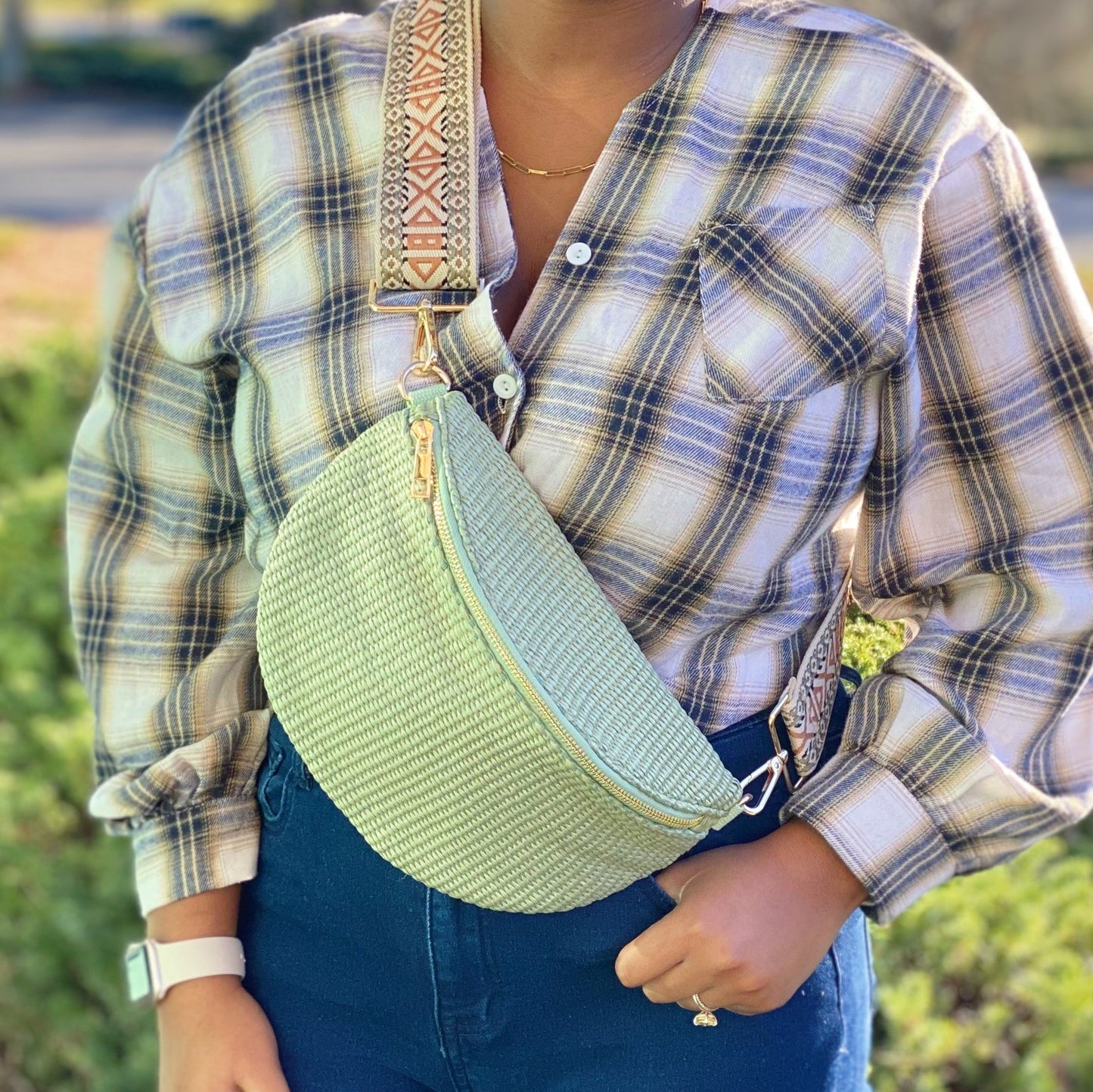 Four Bahama Breeze Fit All Sling Bags by Ellison + Young in pink, black, beige, and green with unique patterned straps are displayed on a white surface.