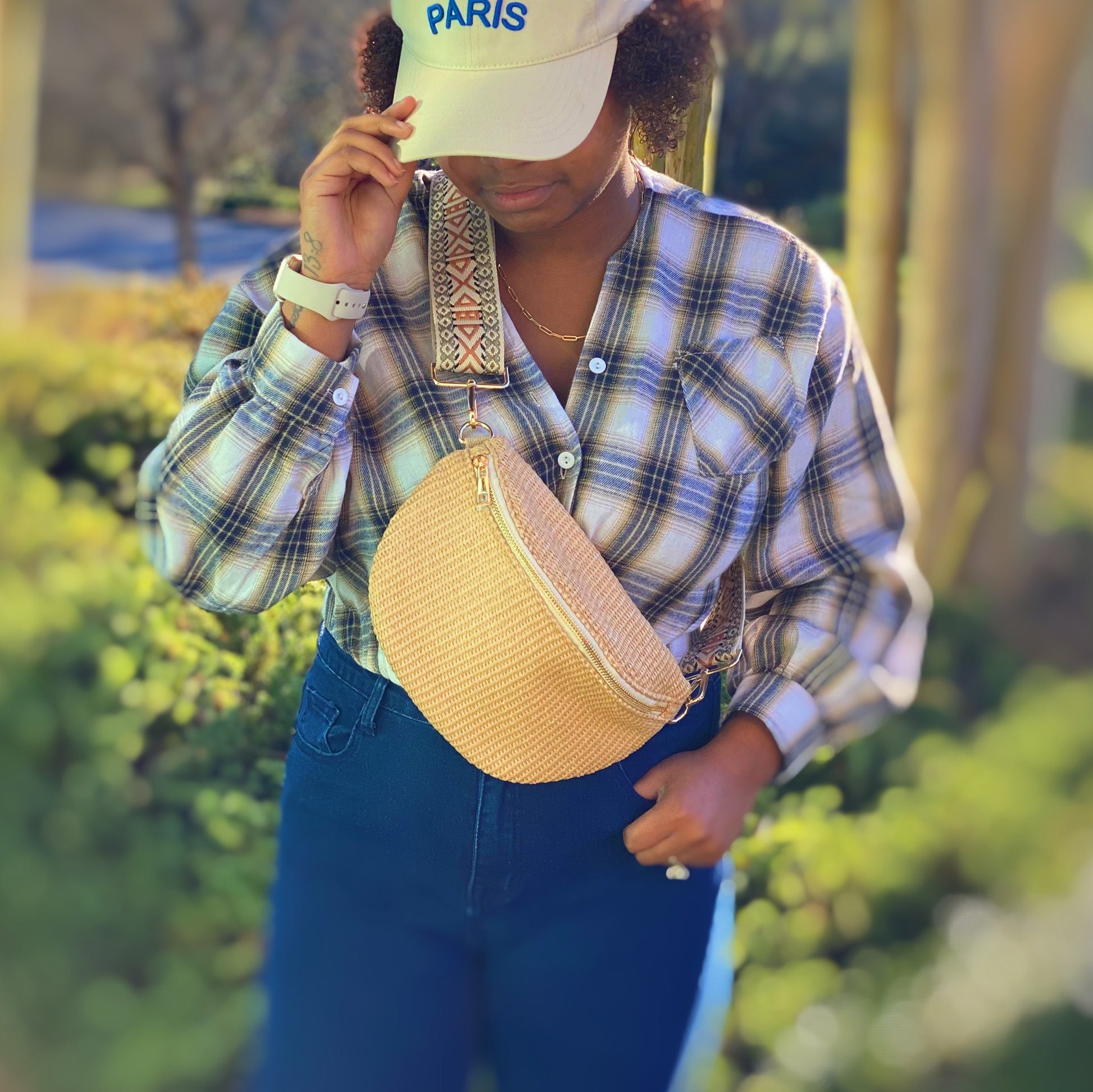 Four Bahama Breeze Fit All Sling Bags by Ellison + Young in pink, black, beige, and green with unique patterned straps are displayed on a white surface.