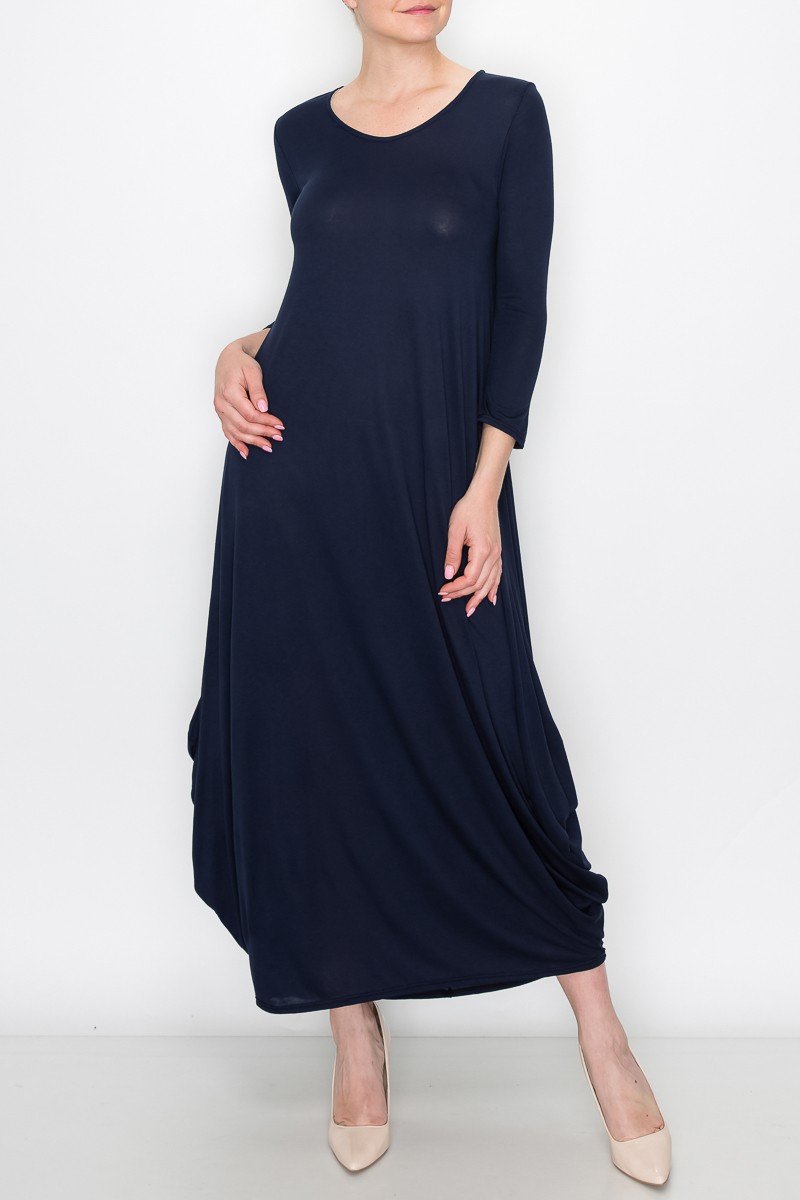 A model showcases the Stylespect Solid Balloon Dress in black, featuring three-quarter sleeves and pairing it with beige heels against a plain white background.