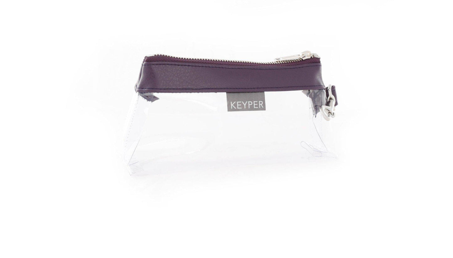 A Pretty Purple Vegan Leather Bag by KEYPER features a gold zipper and strap, showcased on a white background.