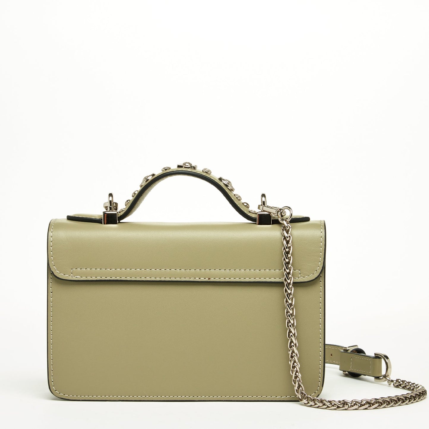 The Hollywood Leather Crossbody Bag by SUSU in sage green features metallic studs and chain straps, elegantly displayed against a plain background.