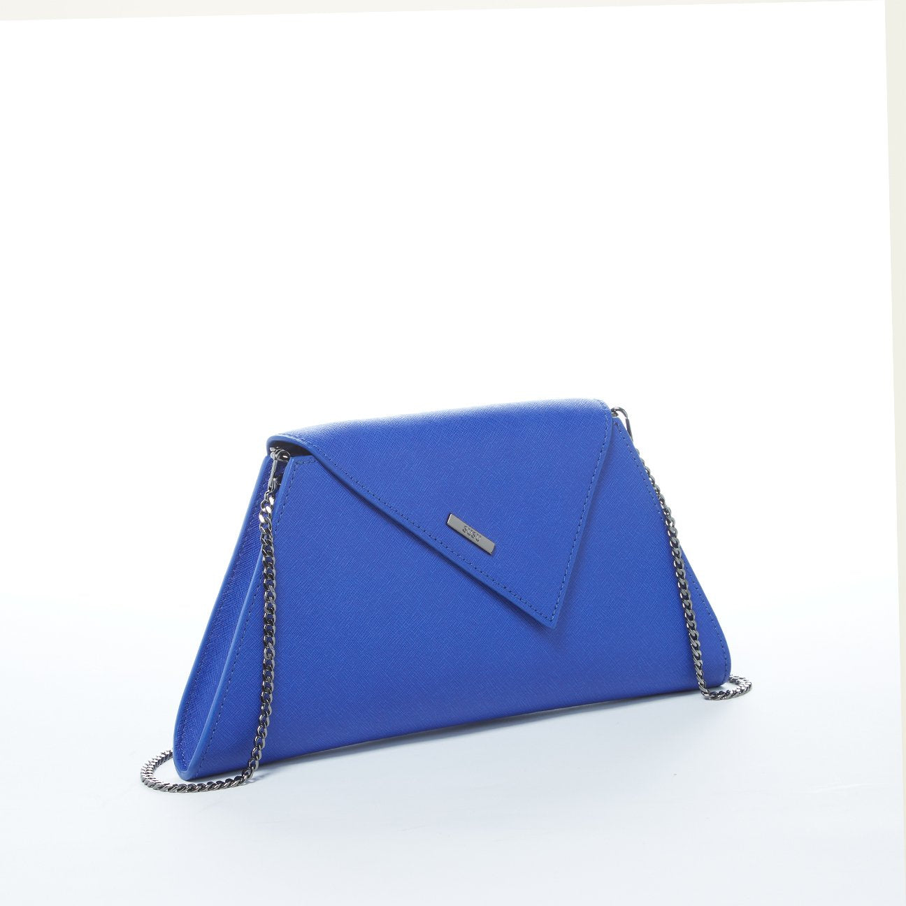 A SUSU Angelica Cobalt Blue Leather Clutch Bag featuring a triangular flap design and a silver chain strap.