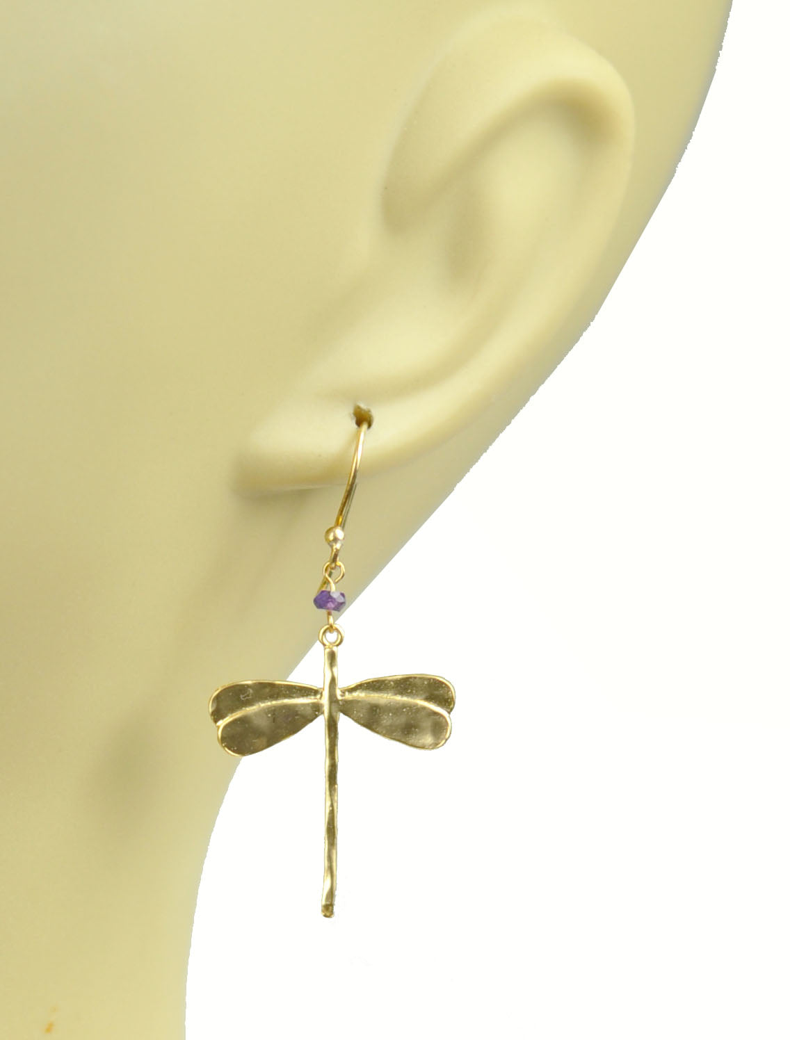 Gena Myint Dragonfly Amethyst Earrings, featuring a gold dragonfly shape adorned with small purple beads.