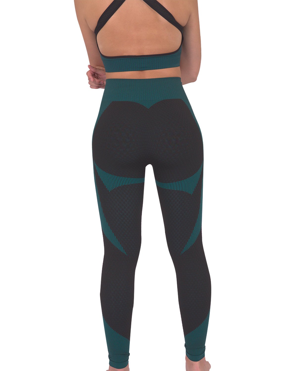 A person wearing Savoy Actives Trois Seamless Legging in Black with Teal Blue and black sneakers stands against a gray textured wall.