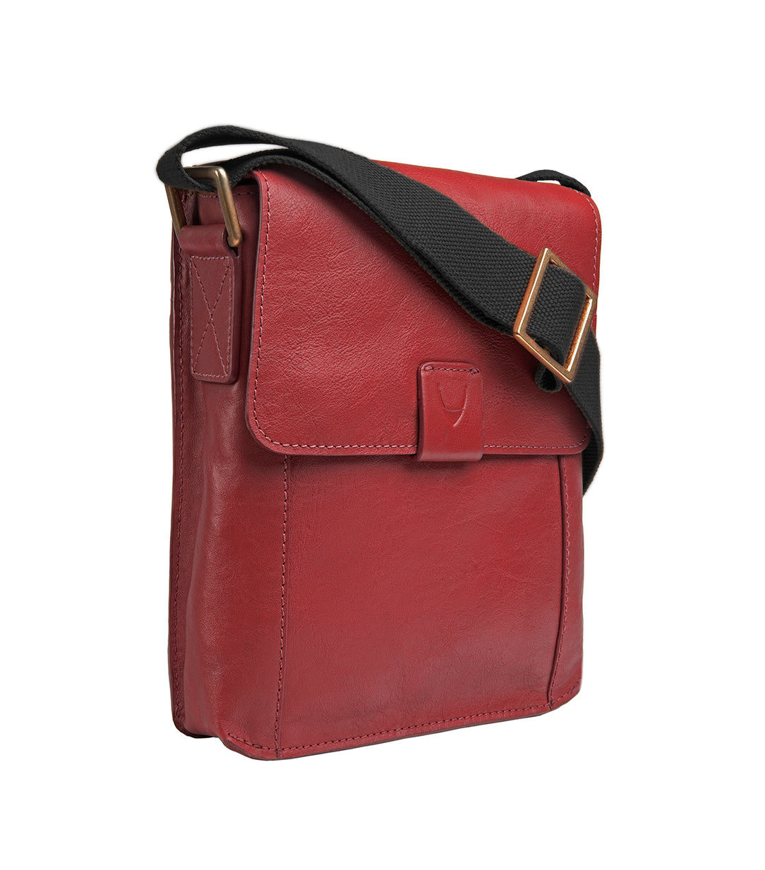 The Aiden Genuine Leather Mini Crossbody by Hidesign is a brown leather shoulder bag featuring a flap cover and an adjustable fabric strap with a brass buckle.