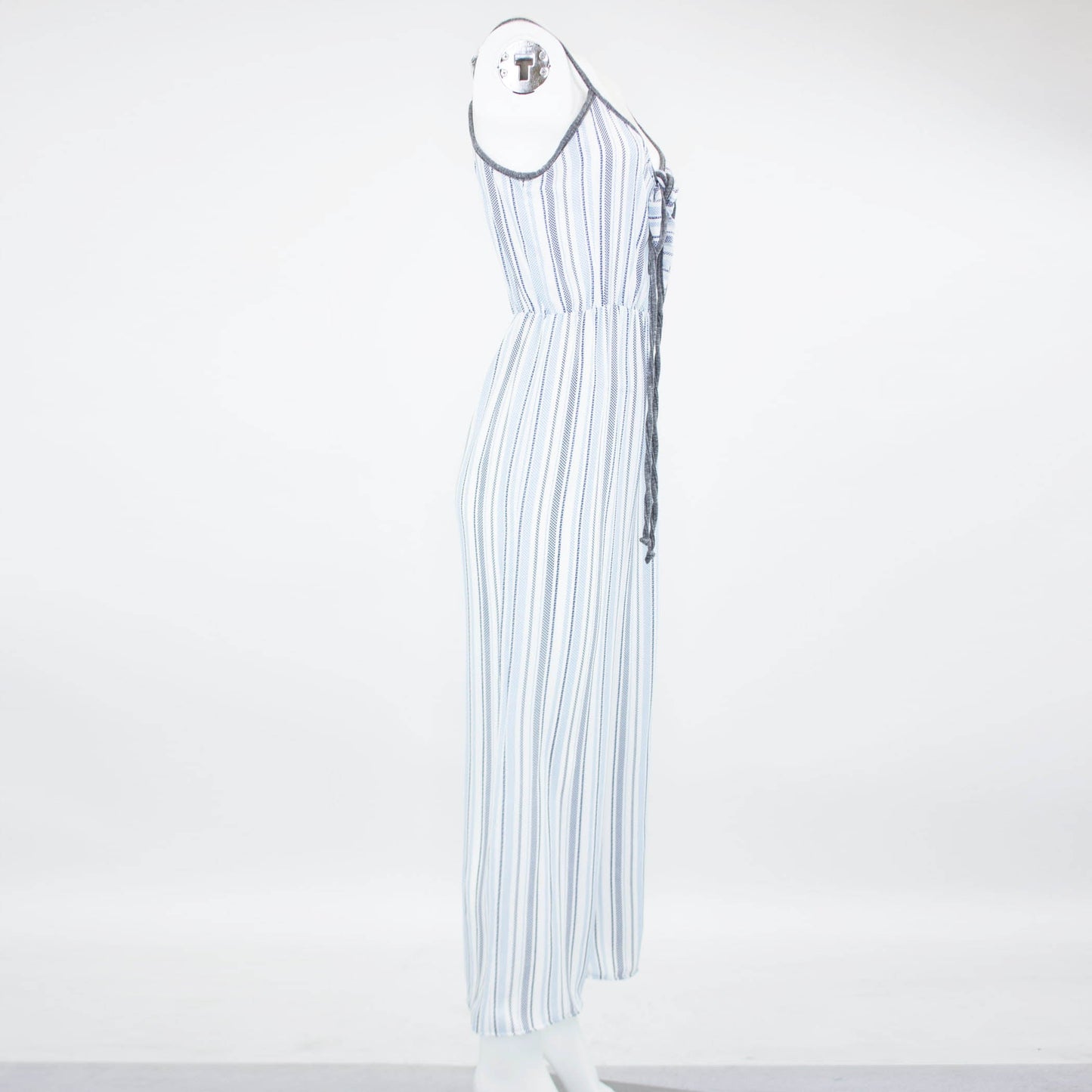 Someone is wearing the Stylespect Front Tie Cropped Jumpsuit in blue with stripes and wide legs, paired with beige pointed heels.