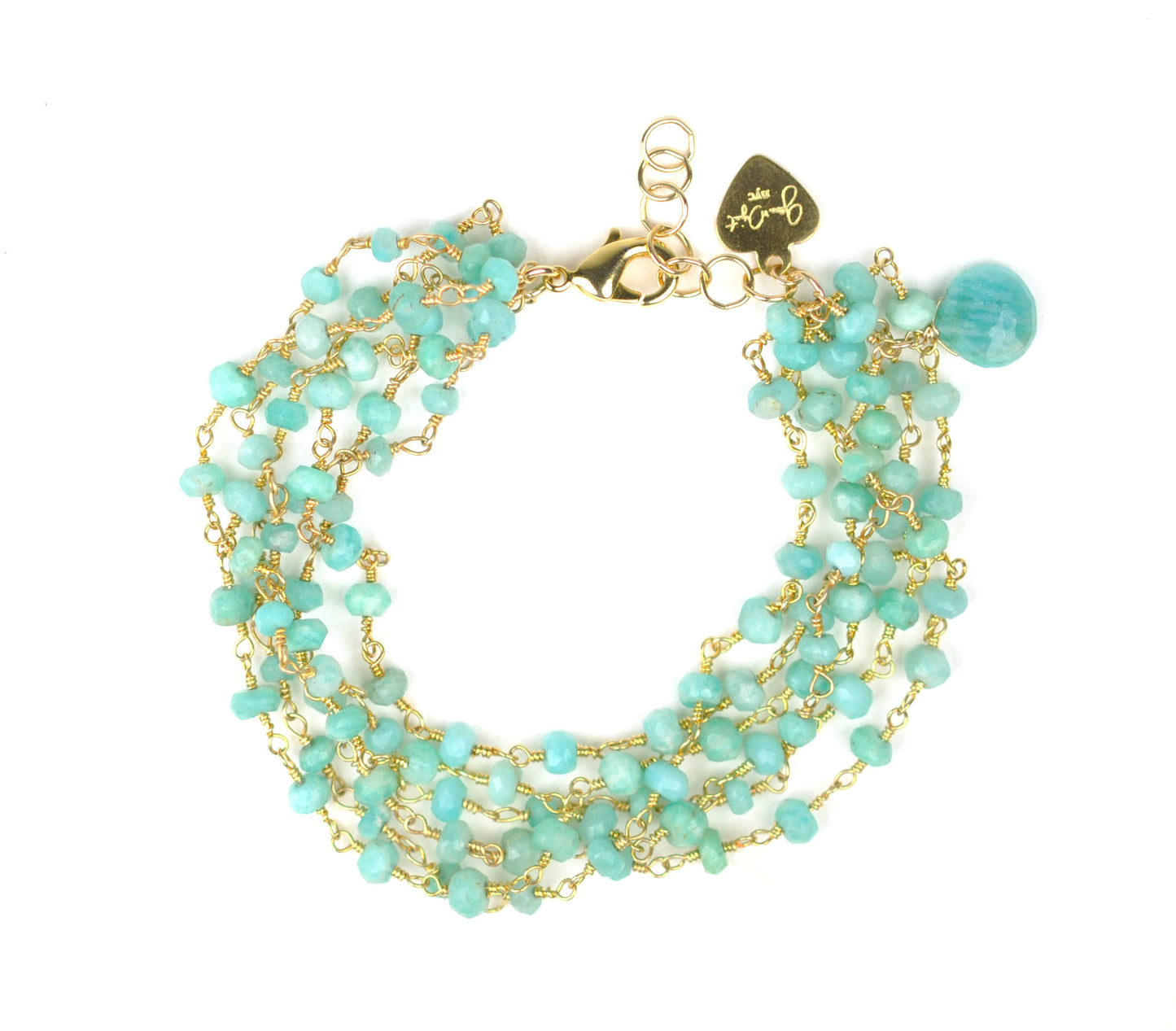 The Amazonite Bracelet by Gena Myint is a multi-strand piece featuring turquoise beads, a gold chain, a heart-shaped charm, and a clasp.