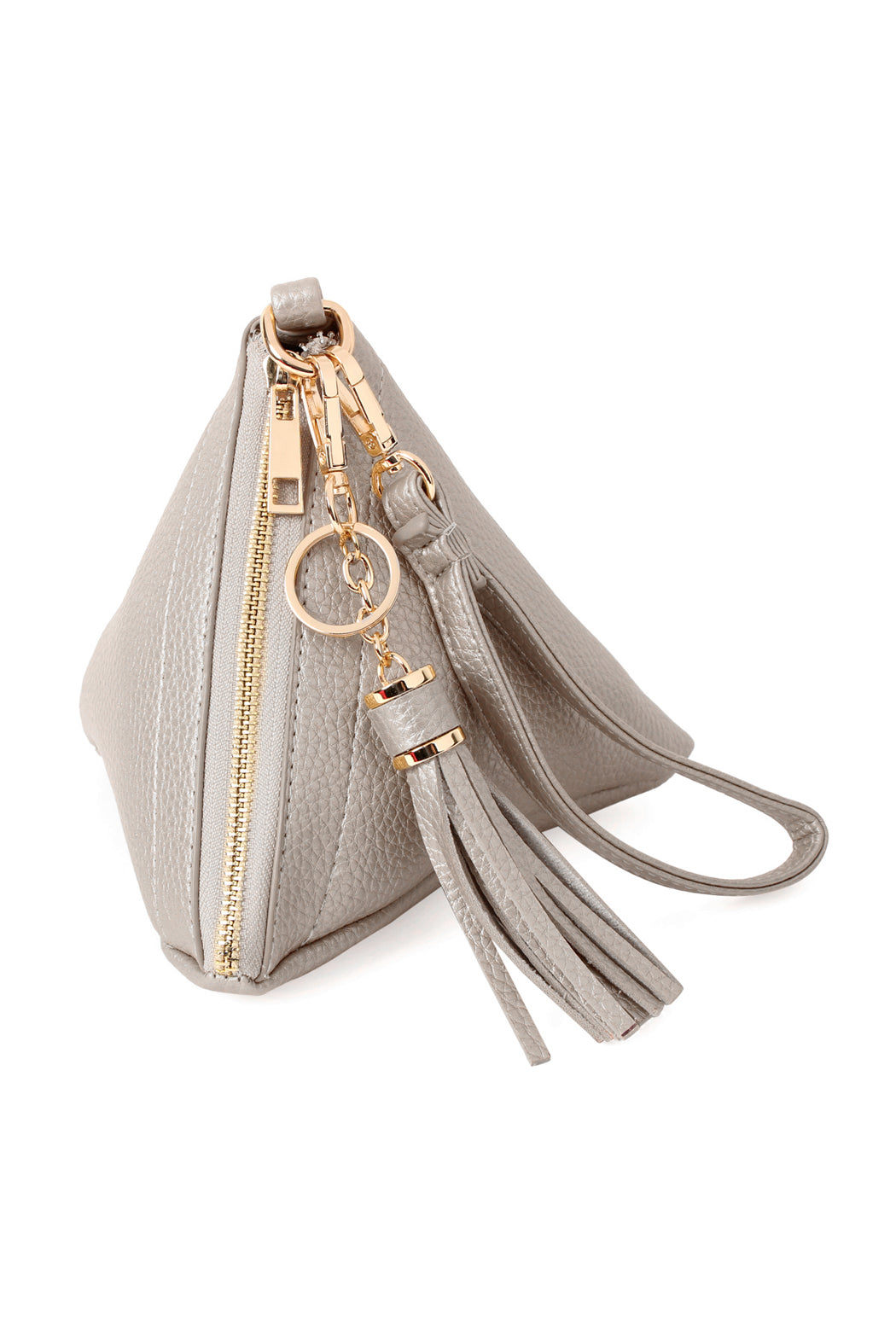 A person in a white shirt and jeans is holding the Riah Fashion Pyramid Shape Tassel Wristlet Leather Bag in orange.