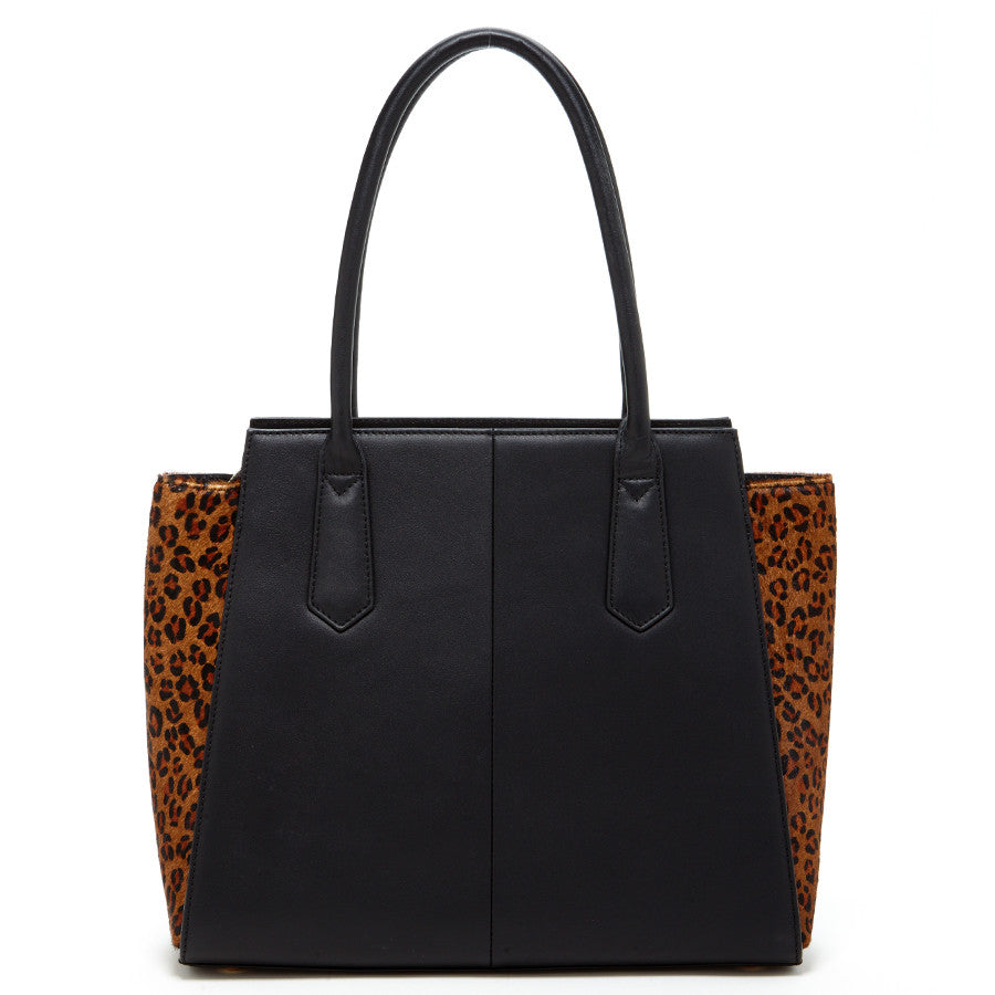 The SUSU Jody Black Leather Tote Bag features a stylish leopard print design and two handles.