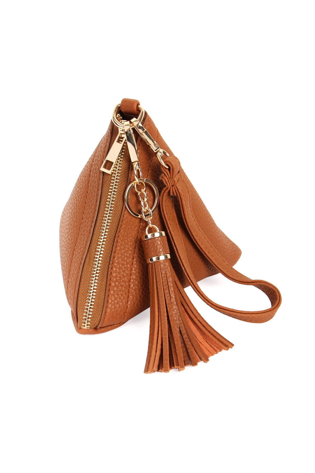 A person in a white shirt and jeans is holding the Riah Fashion Pyramid Shape Tassel Wristlet Leather Bag in orange.