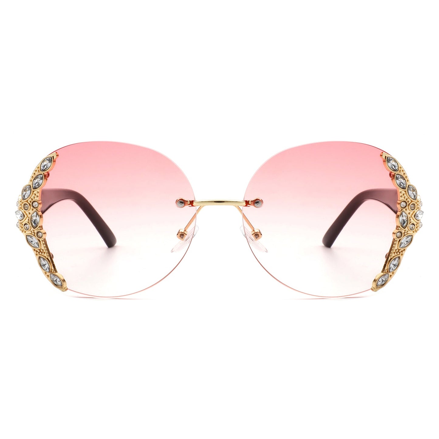 Stylish black sunglasses with oval rimless frames, pink gradient lenses, ornate gold detailing, and rhinestone design by Cramilo Eyewear.