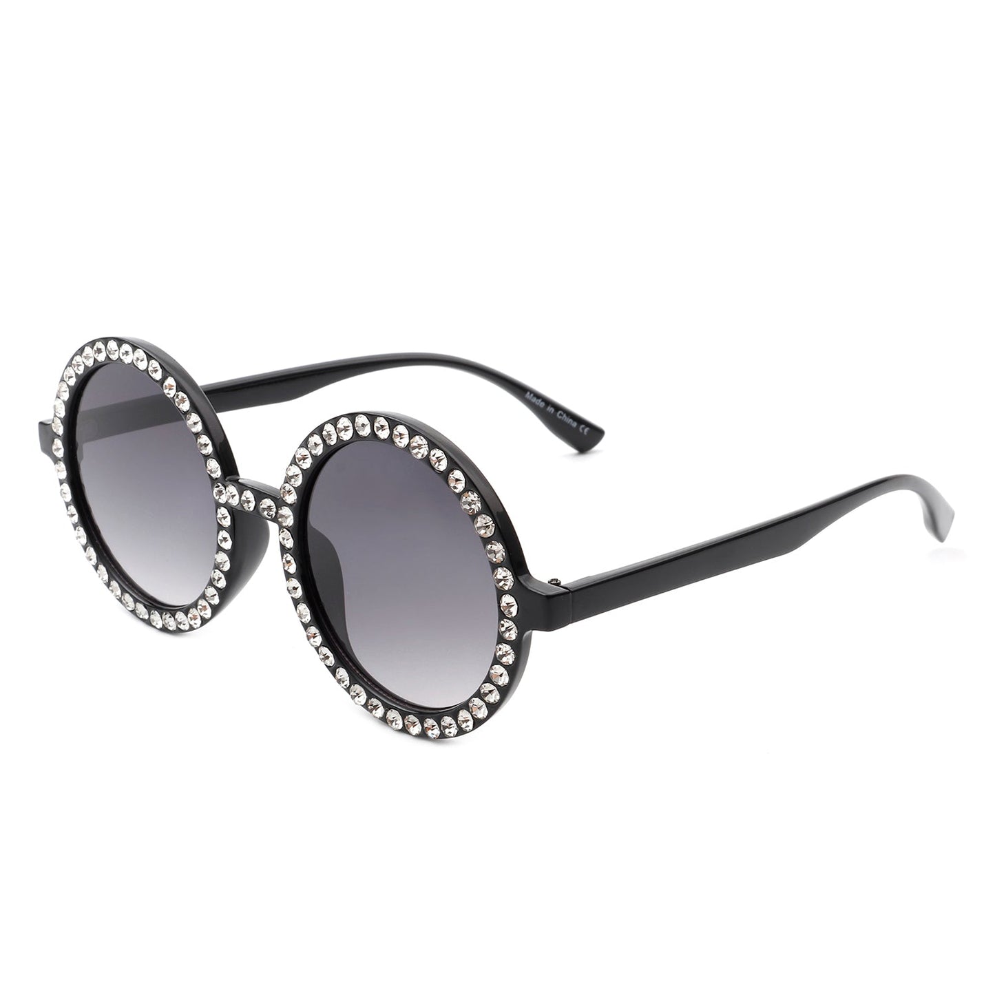 Round sunglasses by Cramilo Eyewear, Dreamwey model, featuring rhinestone-studded white frames with dark lenses.