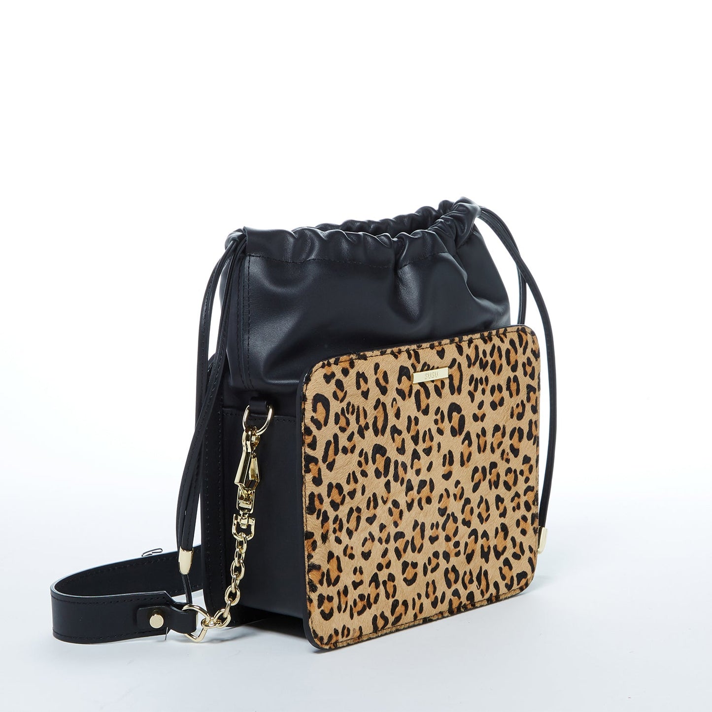 The Patricia Black Leopard Leather Purse by SUSU features a leopard print, black leather accents, drawstring closure, detachable strap, and gold hardware.