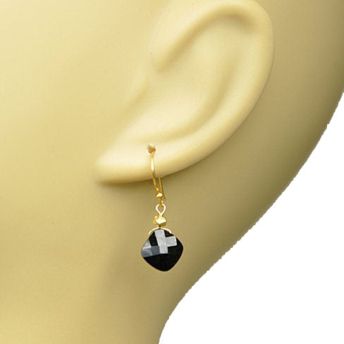 Gena Myints Black Spinel Drop Earrings with gold hooks.