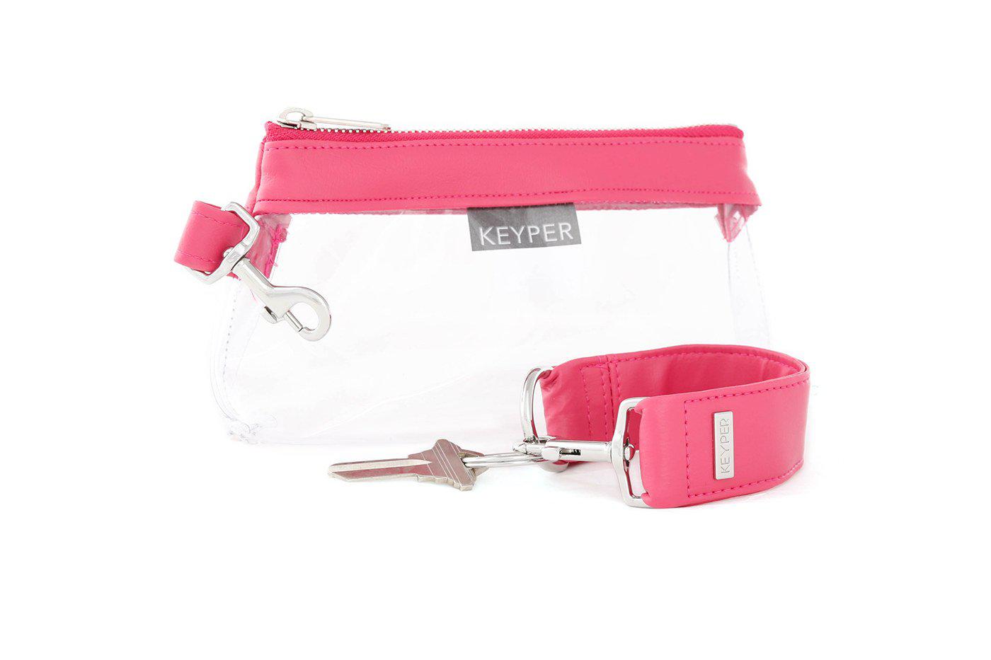 The KEYPER Bright Pink Vegan Leather 2-Piece WRISTLET SET includes a small pink pouch with a zipper, gold clasp, an attached pink strap, and a set of keys.