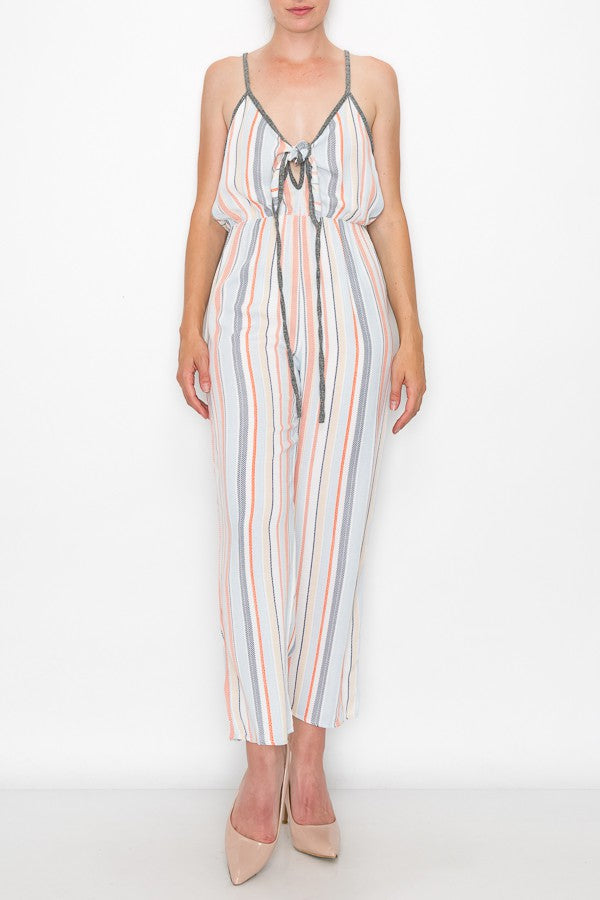 A person wearing the Stylespect Front Tie Cropped Jumpsuit in orange and beige heels stands against a plain white background.