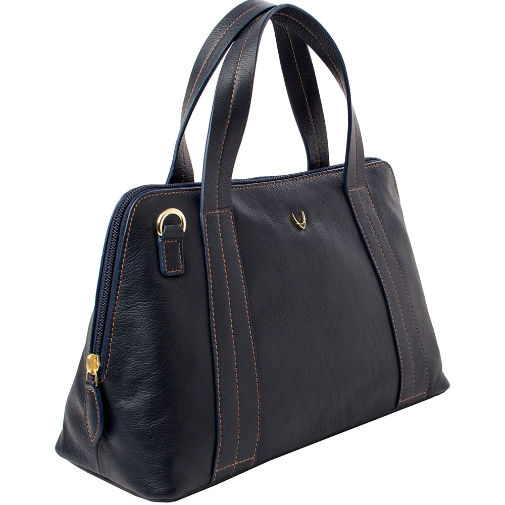 The Hidesign Cerys Leather Satchel features black leather, double handles, gold accents, and visible stitching.