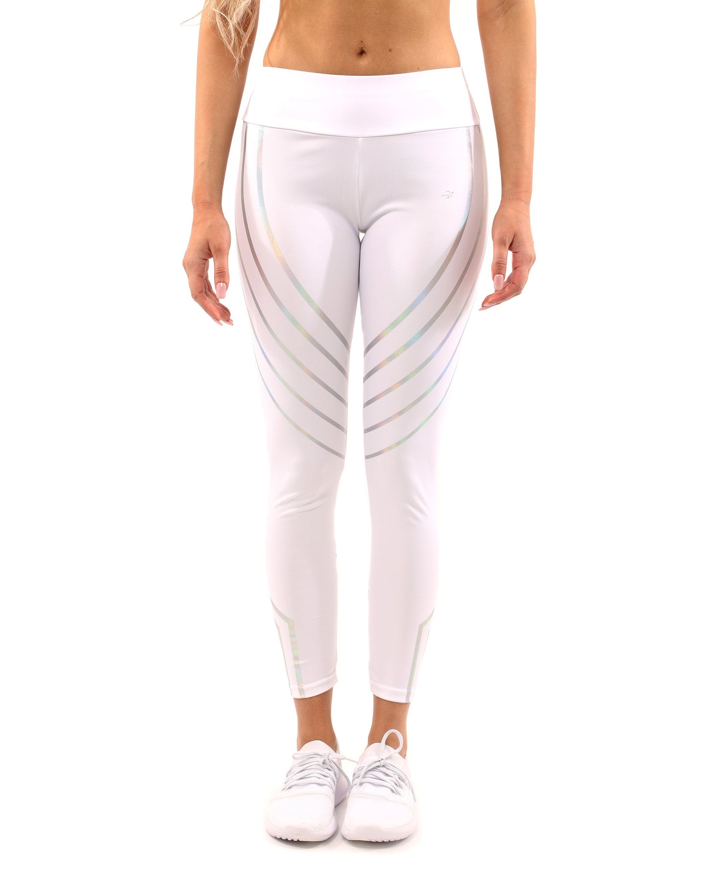 Person in the Laguna Set by Savoy Active, featuring a white sports bra and leggings with striped details, stands against a white background. They are also wearing sneakers.