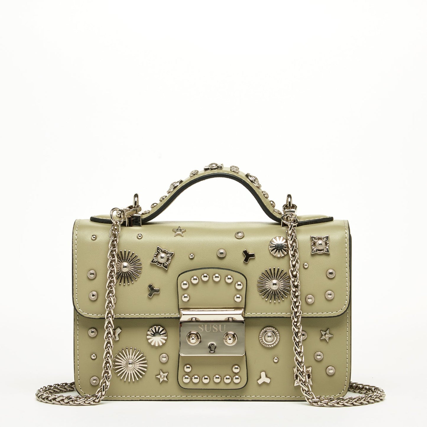 The Hollywood Leather Crossbody Bag by SUSU in sage green features metallic studs and chain straps, elegantly displayed against a plain background.