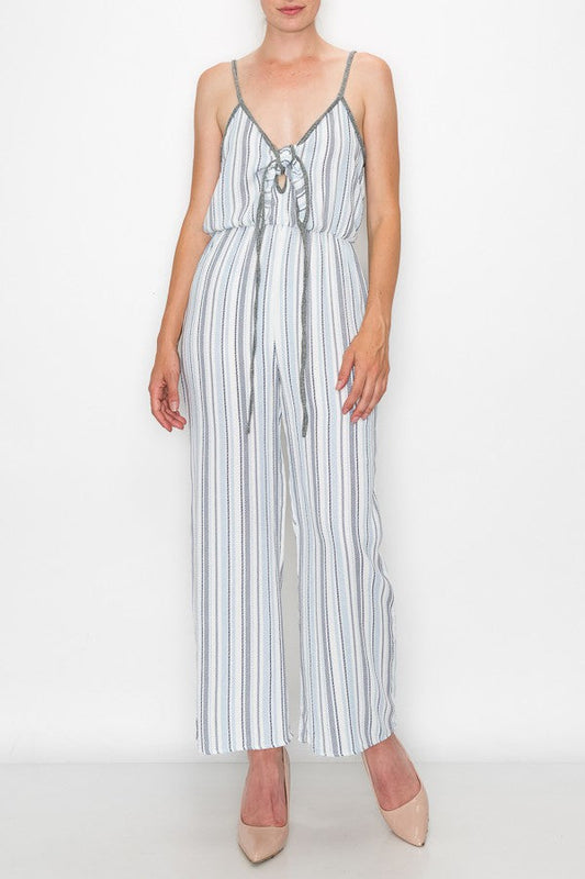 Someone is wearing the Stylespect Front Tie Cropped Jumpsuit in blue with stripes and wide legs, paired with beige pointed heels.