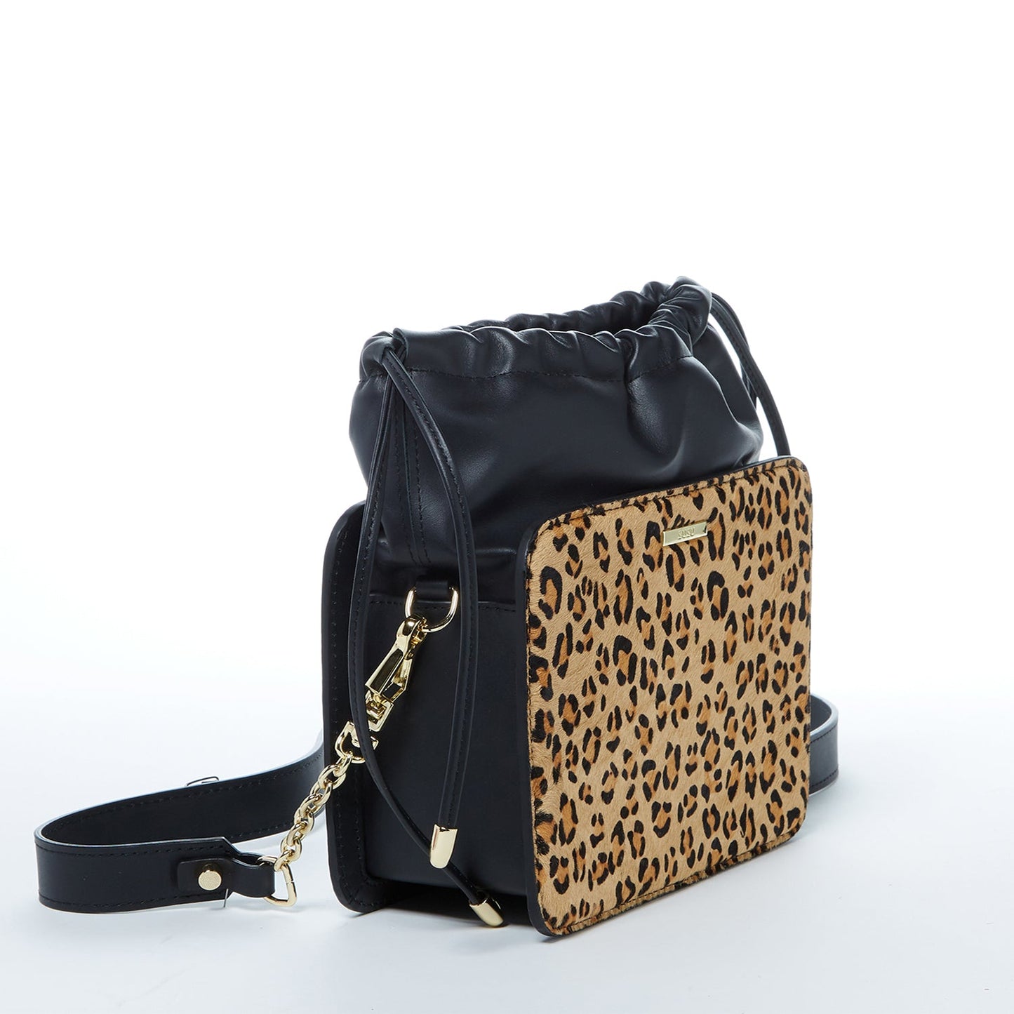 The Patricia Black Leopard Leather Purse by SUSU features a leopard print, black leather accents, drawstring closure, detachable strap, and gold hardware.