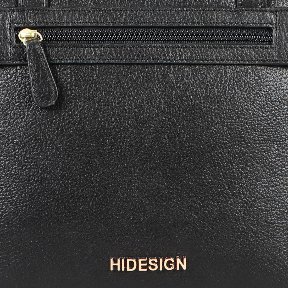 A black Hidesign Clarida Womens Classic Leather Handbag with two shoulder straps, a zippered front pocket, and HIDESIGN embossed in gold at the bottom.