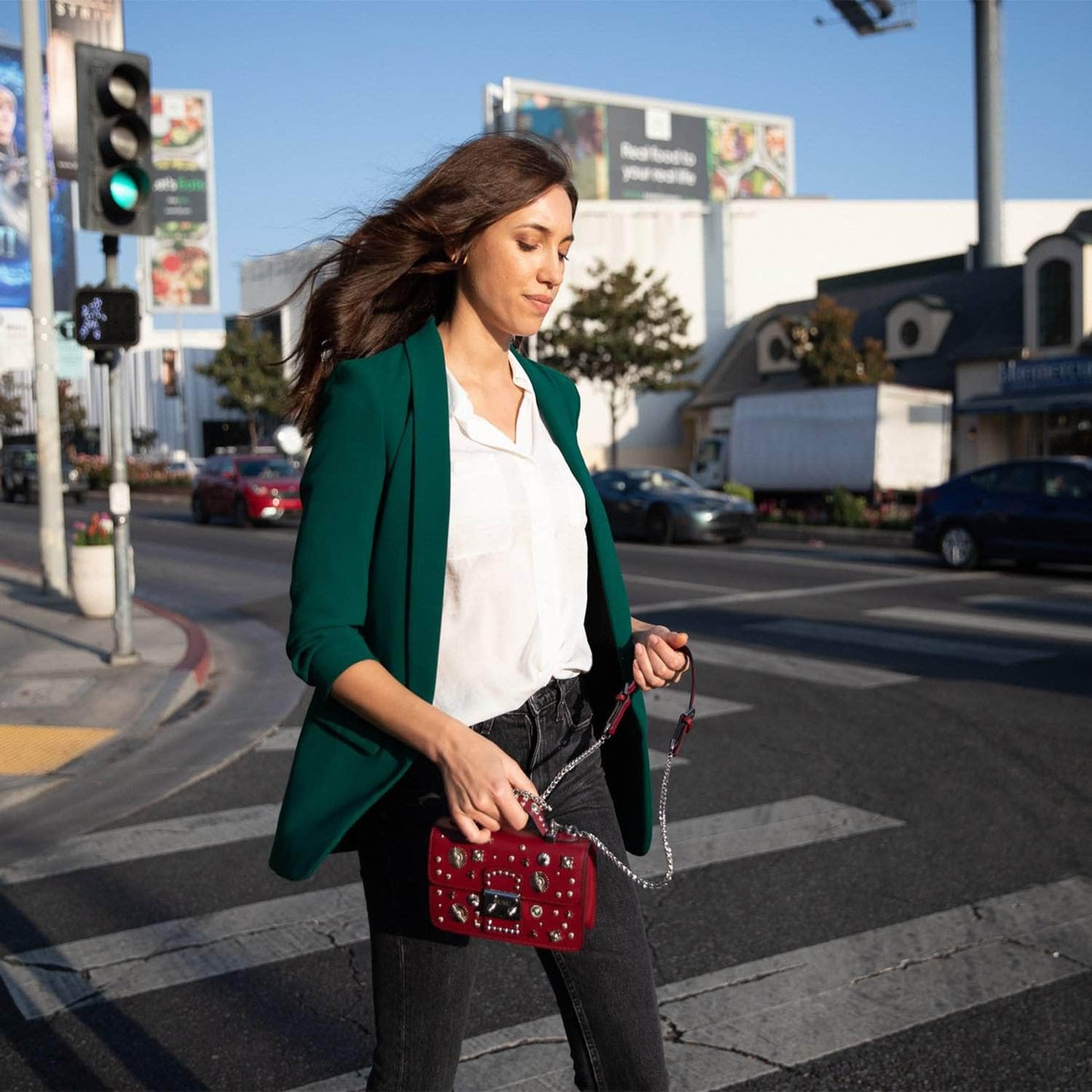 Burgundy leather handbag with silver studs, a short handle, and chain shoulder strap, featuring a SUSU engraved metal clasp.