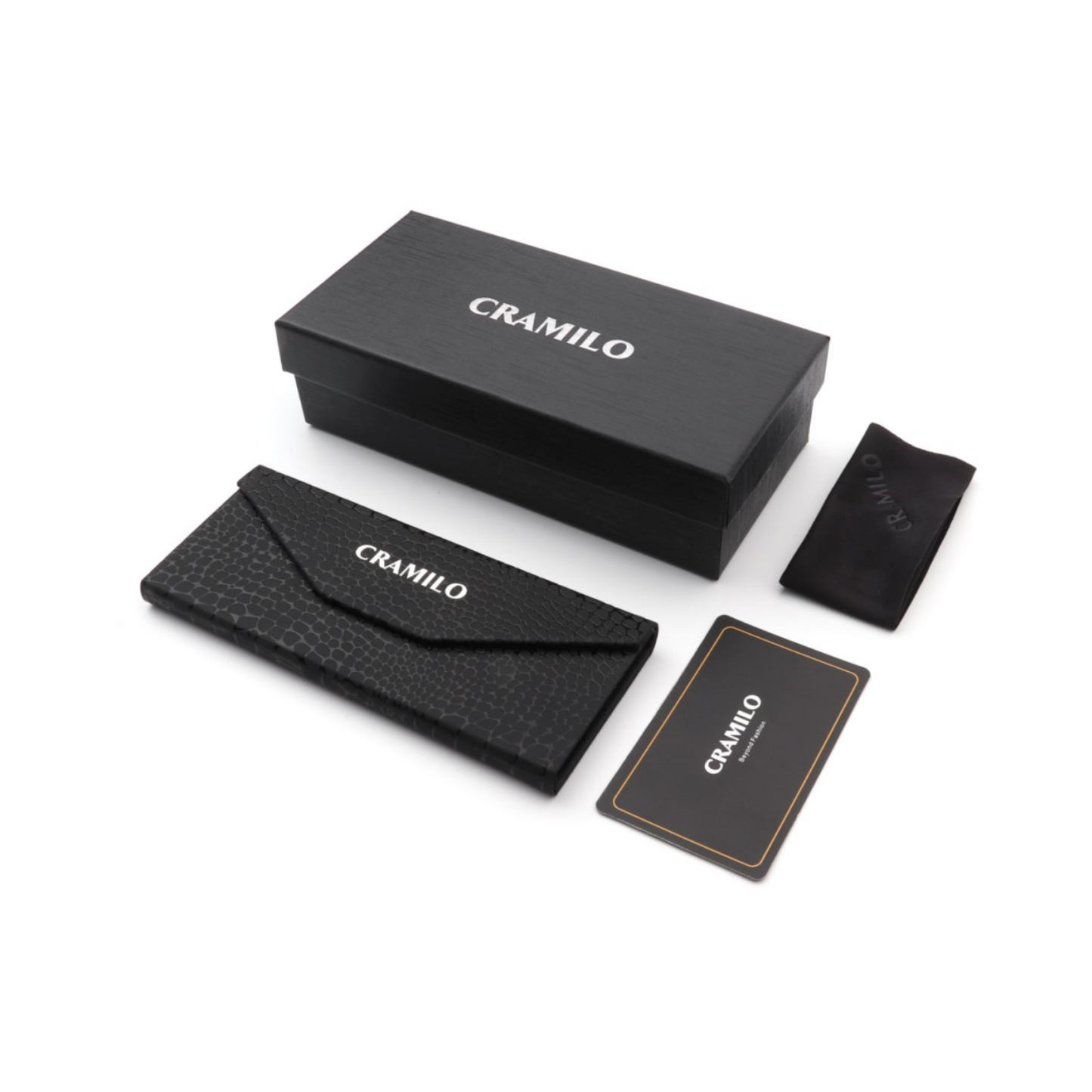 BOYDS women’s round cat-eye sunglasses by Cramilo Eyewear feature pink glittery frames and dark lenses on a white background.