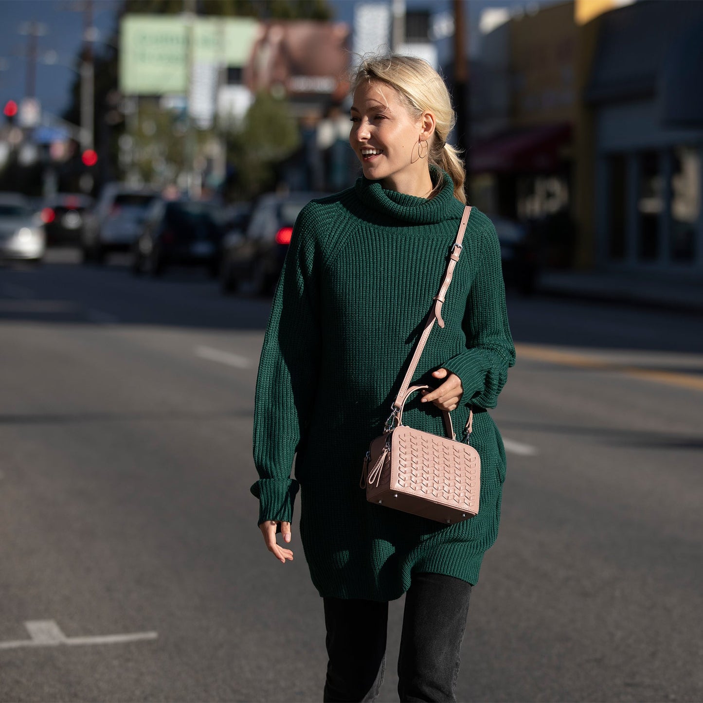 The SUSU Kayla Pink Woven Leather Bag features a textured front pattern, top handles, and a detachable shoulder strap.