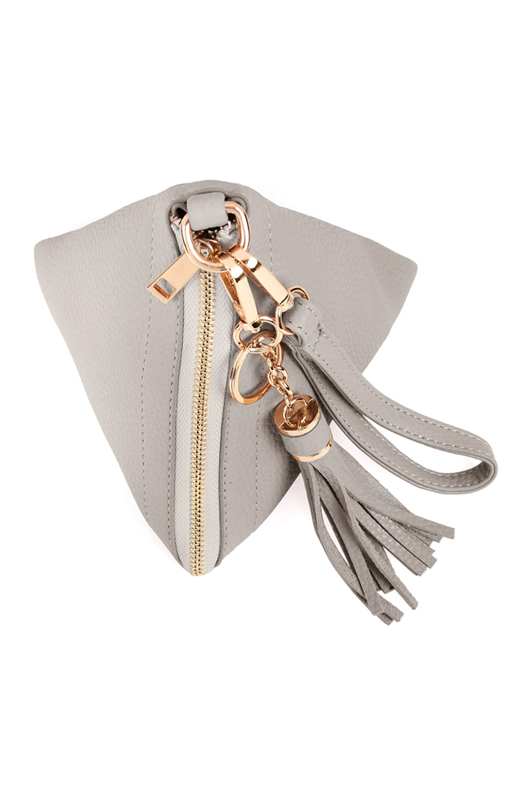 A person in a white shirt and jeans is holding the Riah Fashion Pyramid Shape Tassel Wristlet Leather Bag in orange.