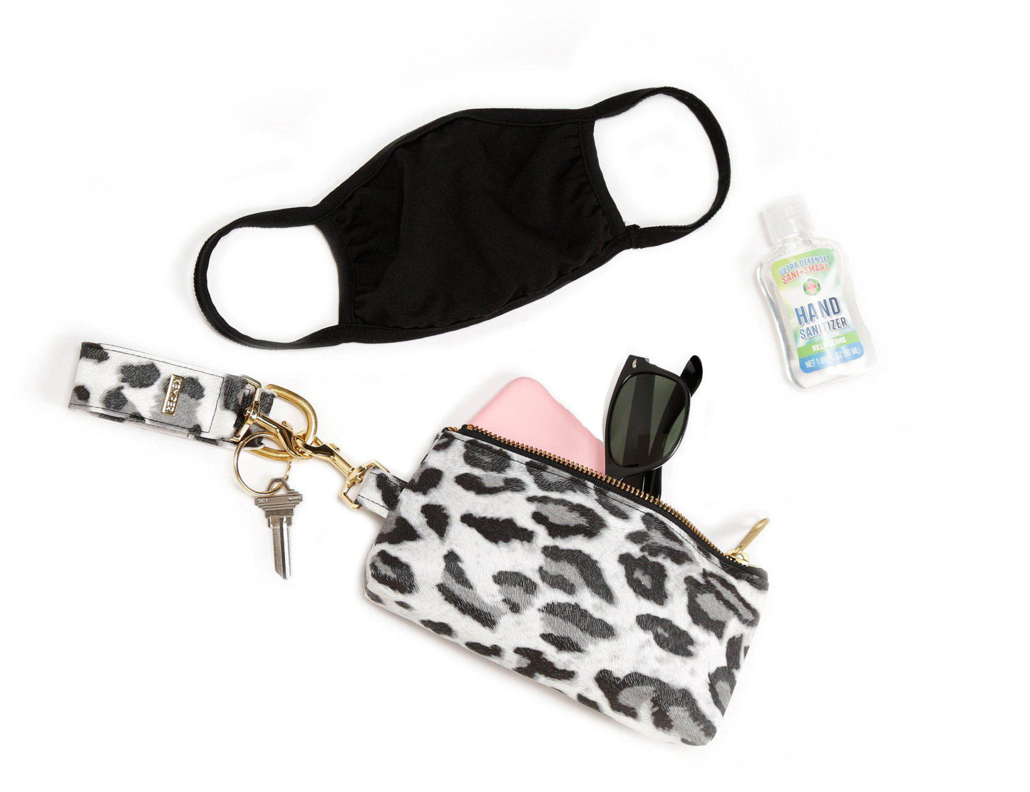The KEYPER Persimmon Vegan Leather 2-Piece Wristlet Set features a clutch bag with a gold zipper, detachable strap, and small gold keychain.