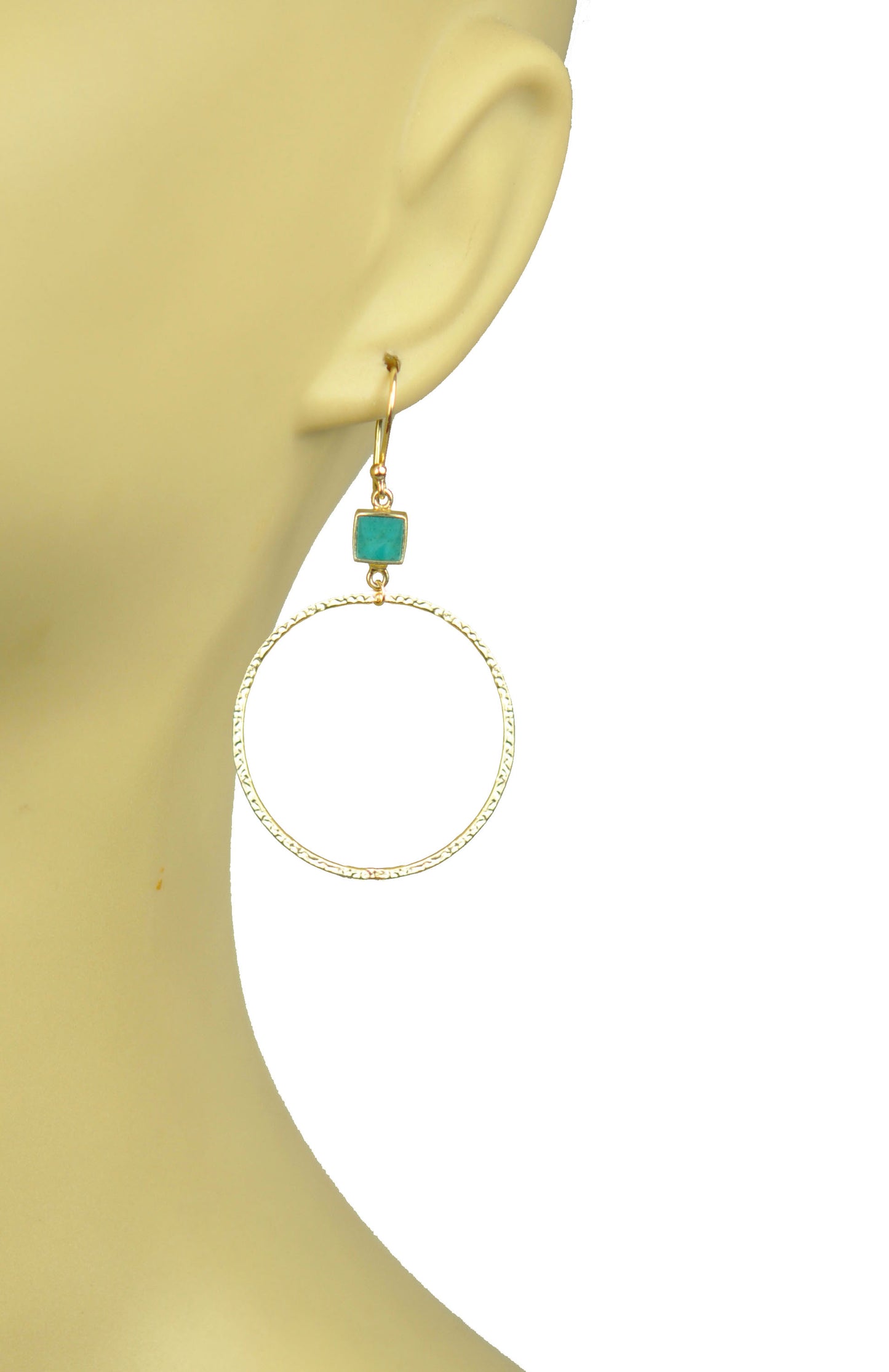 Gold hoop earrings featuring turquoise bezel accents on hooks by Gena Myint.