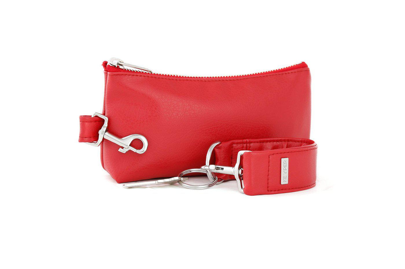A red vegan leather wristlet set from KEYPER, featuring a gold zipper and detachable strap with gold hardware.