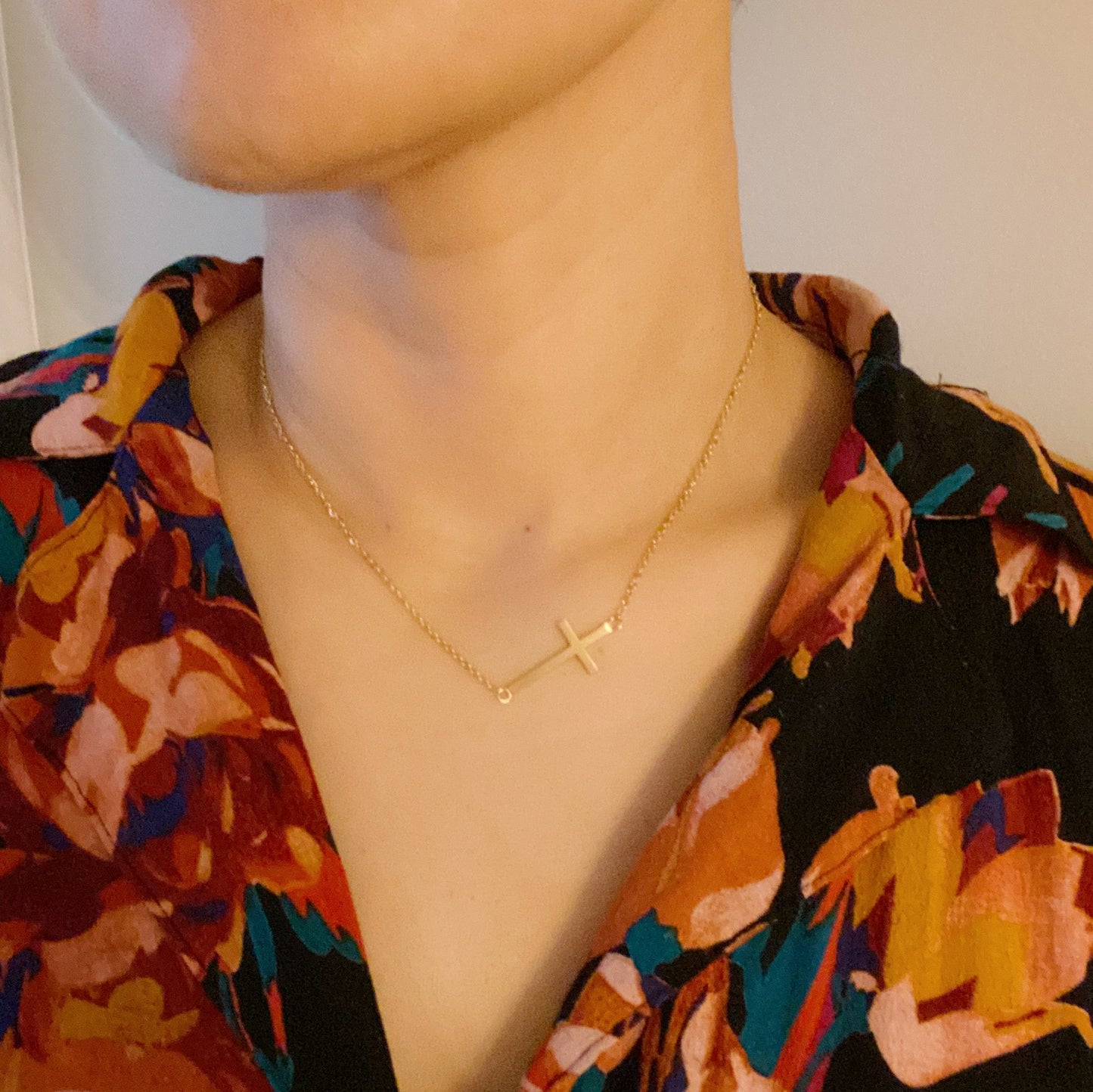 Two Kayla Cross Necklaces from Ellison + Young, one silver and one gold, presented on a white surface.