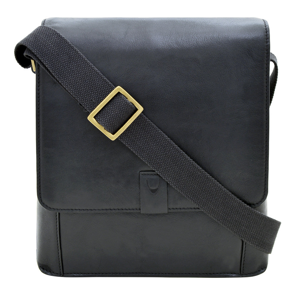 Hidesigns Aiden Genuine Leather Medium Crossbody is a dark brown shoulder bag featuring a wide strap and rectangular brass buckle.