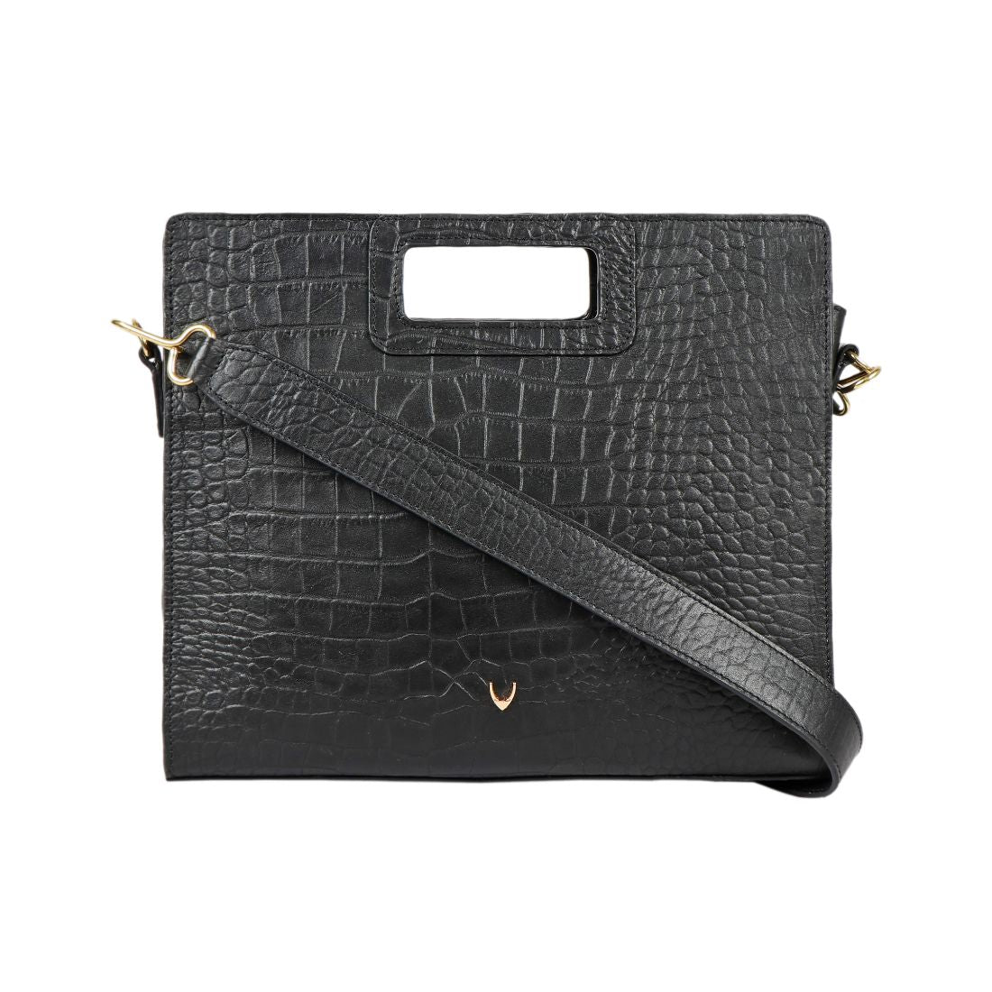 A Hidesign leather handbag in black features a textured design, rectangular cutout handle, and detachable shoulder strap.