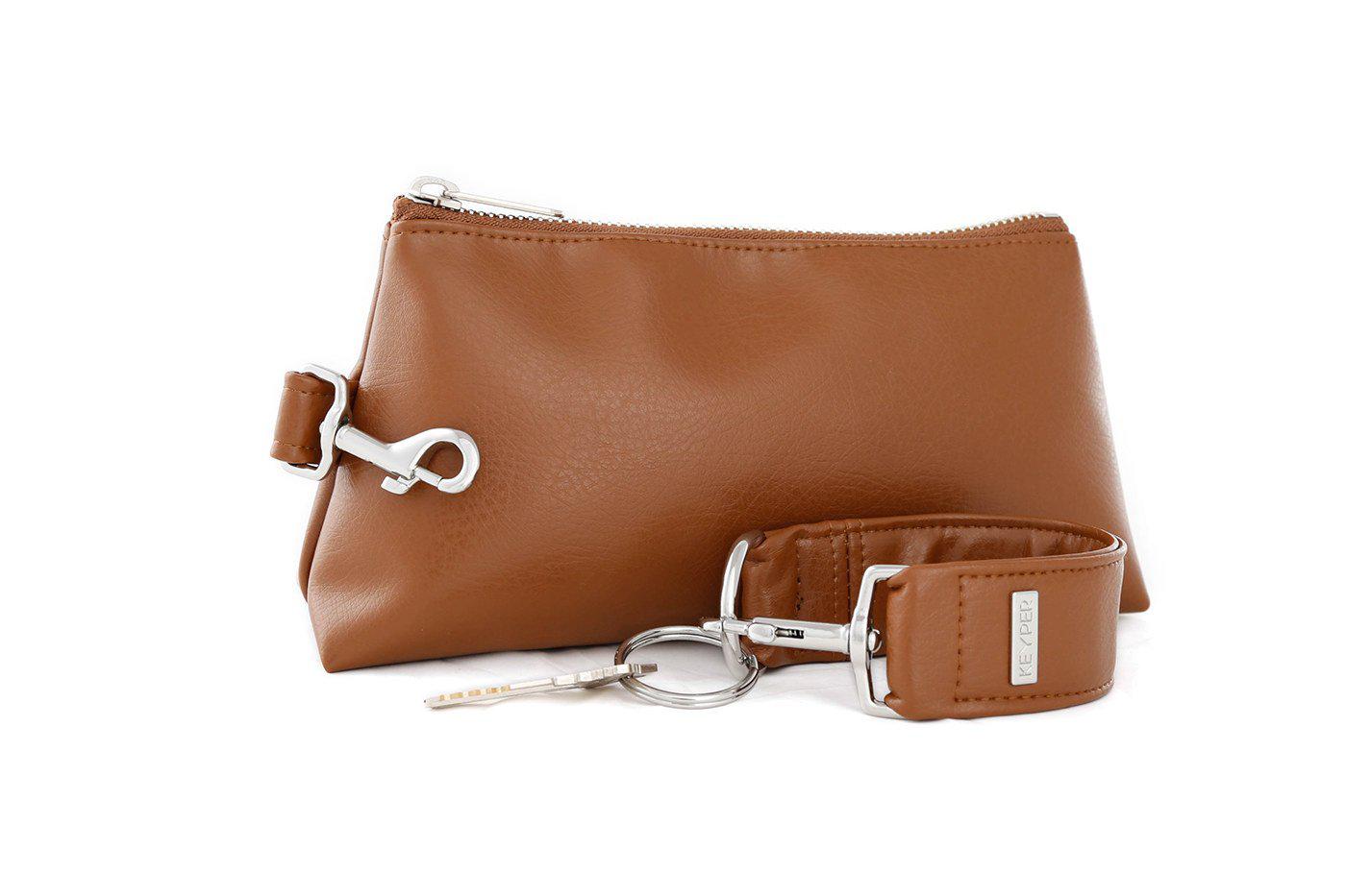 Saddle Brown Vegan Leather 2-Piece Wristlet Set by KEYPER, featuring a detachable matching strap and gold hardware, set against a white background.