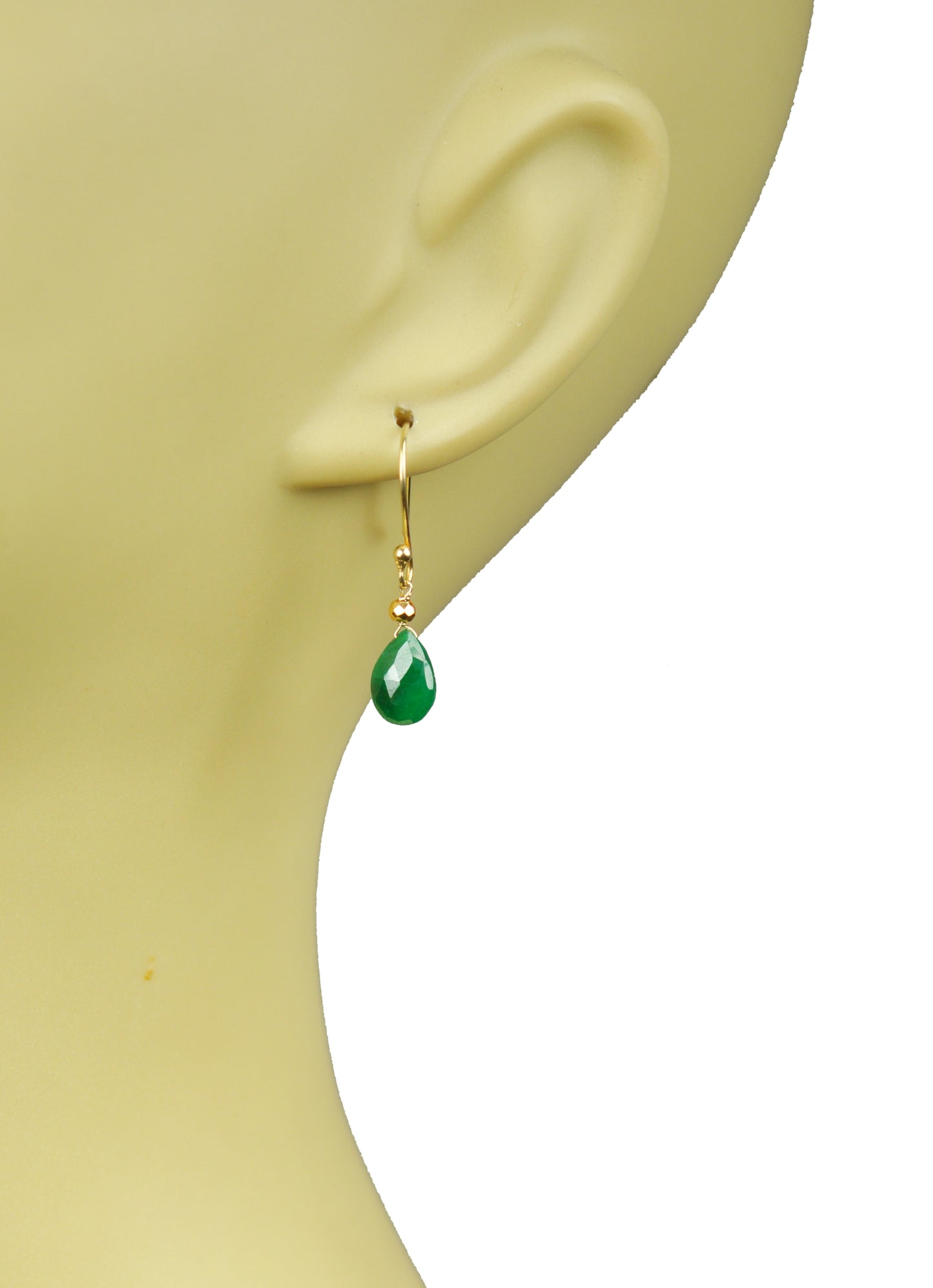 The Emerald Drop Vermeil Earrings by Gena Myint feature gold hooks with green teardrop-shaped gemstones and small clear stones above them.