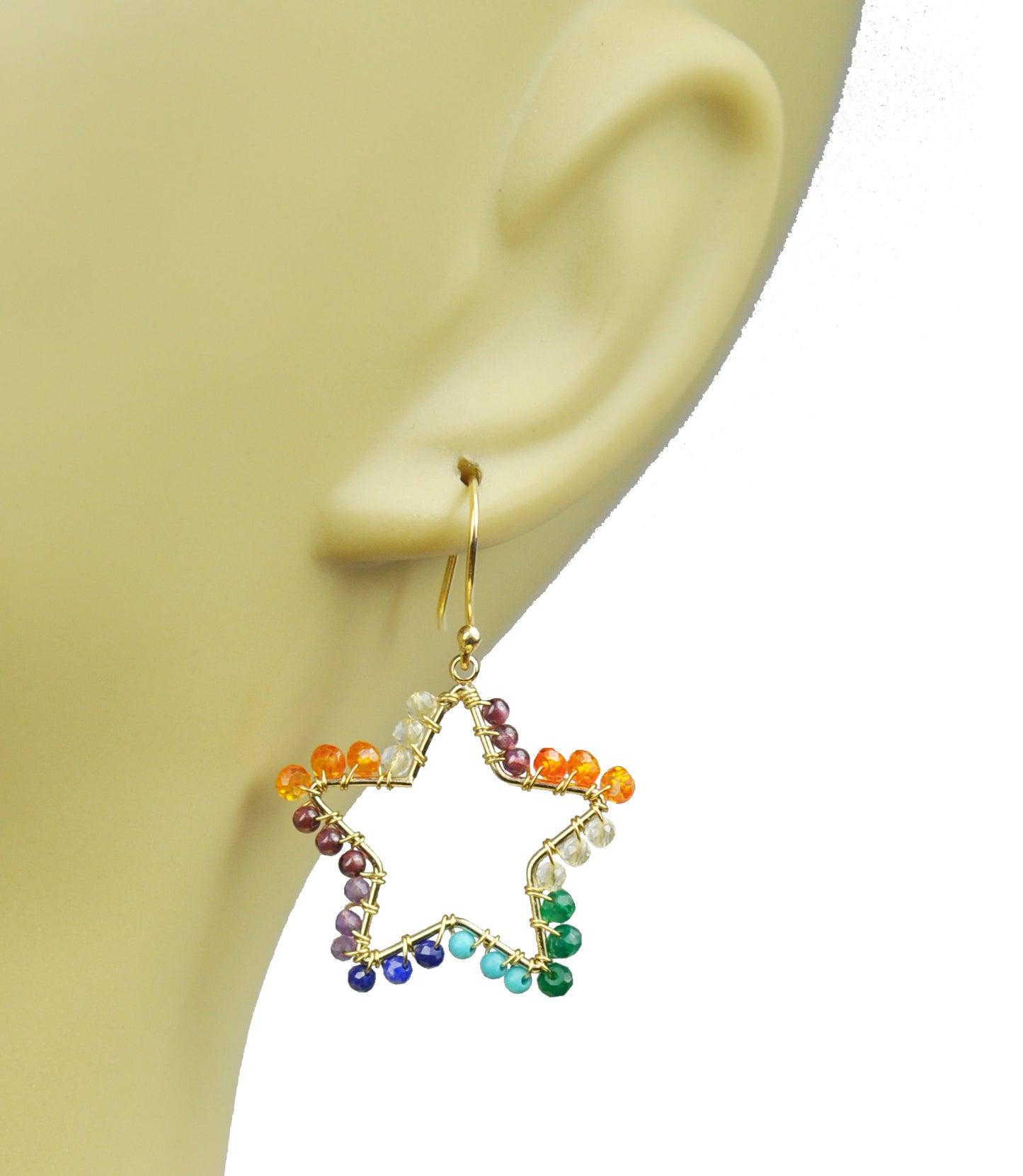 The Chakra Star Vermeil Earrings by Gena Myint feature a gold wire frame in a star shape, adorned with multicolored beads—orange, green, blue, and purple—on a white background.