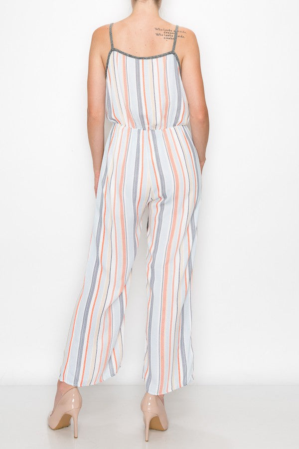 A person wearing the Stylespect Front Tie Cropped Jumpsuit in orange and beige heels stands against a plain white background.