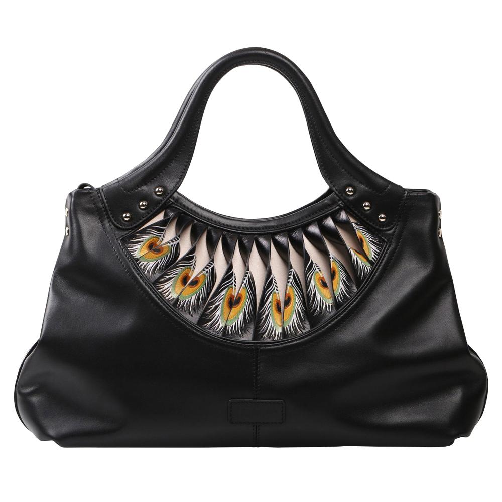 The Bellorita Feather Black Tote is a black leather handbag featuring a decorative peacock feather pattern near the handle, adorned with small metal studs.