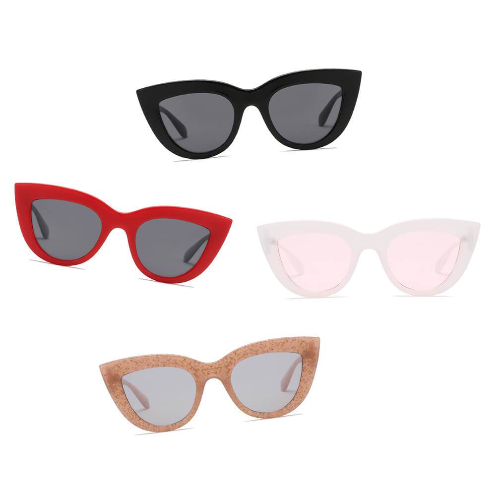 BOYDS women’s round cat-eye sunglasses by Cramilo Eyewear feature pink glittery frames and dark lenses on a white background.
