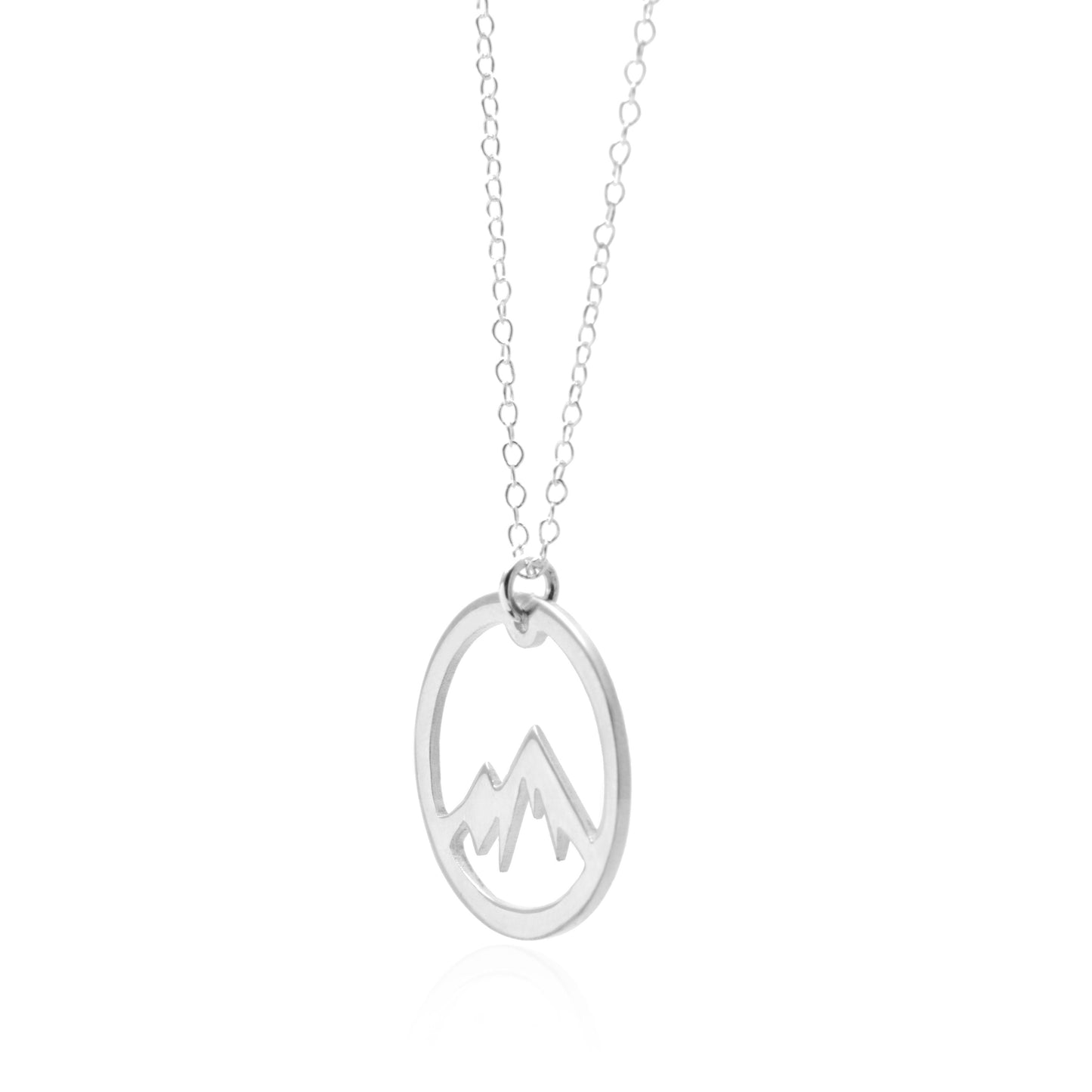 A person wearing a beige sleeveless top accessorized with the Silver Mountain Necklace by Sincerely Silver.