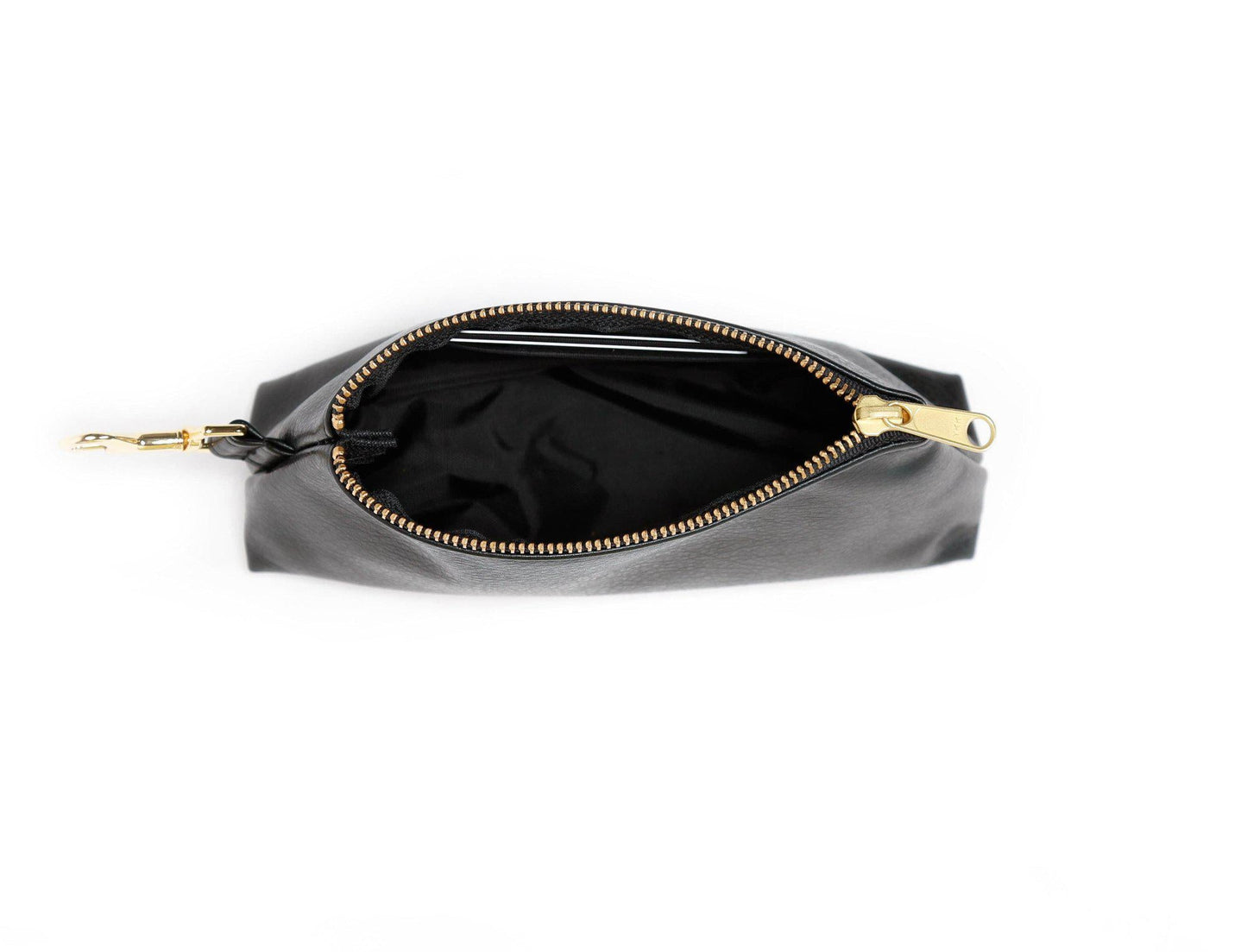 The KEYPER Persimmon Vegan Leather 2-Piece Wristlet Set features a clutch bag with a gold zipper, detachable strap, and small gold keychain.