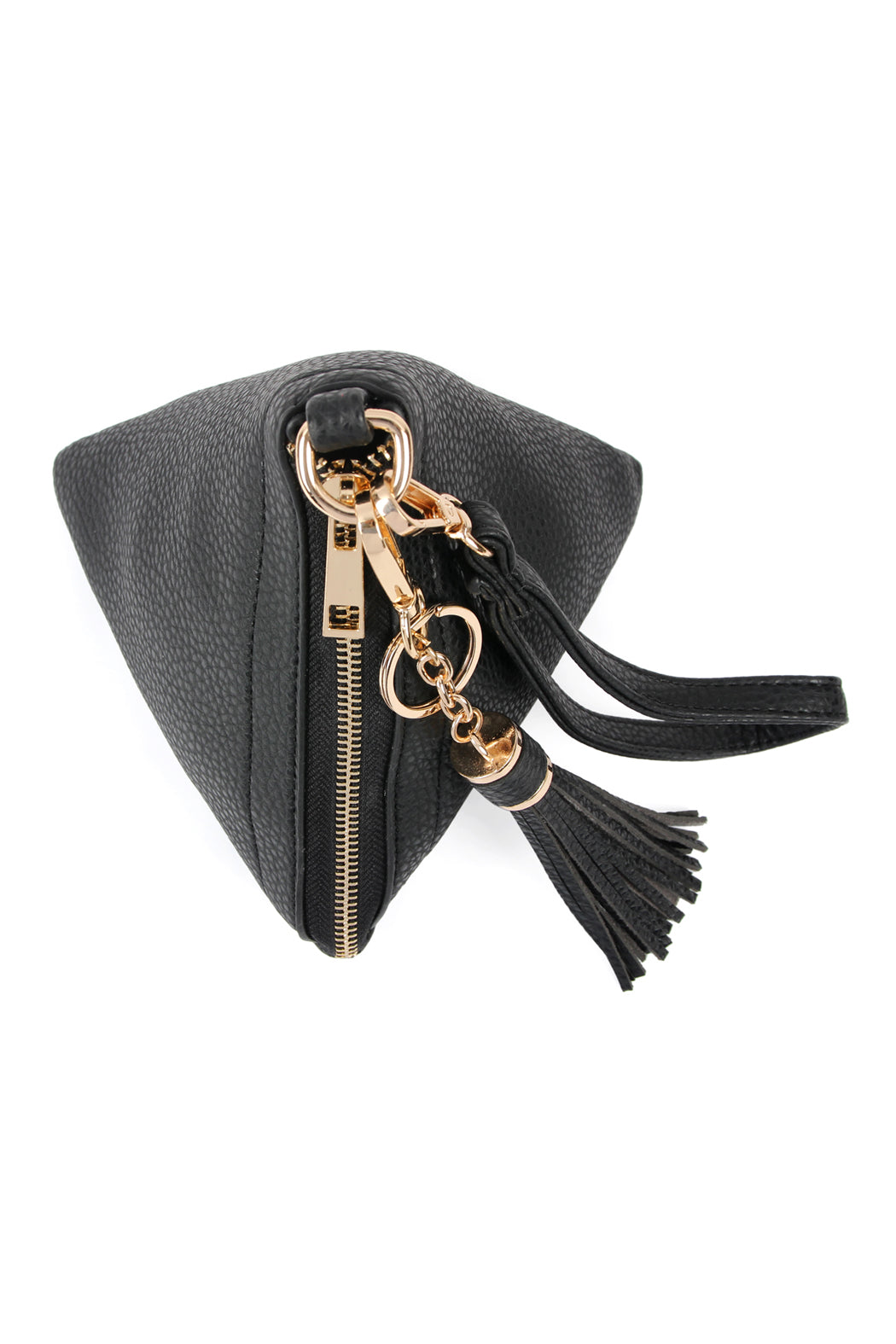 A person in a white shirt and jeans is holding the Riah Fashion Pyramid Shape Tassel Wristlet Leather Bag in orange.