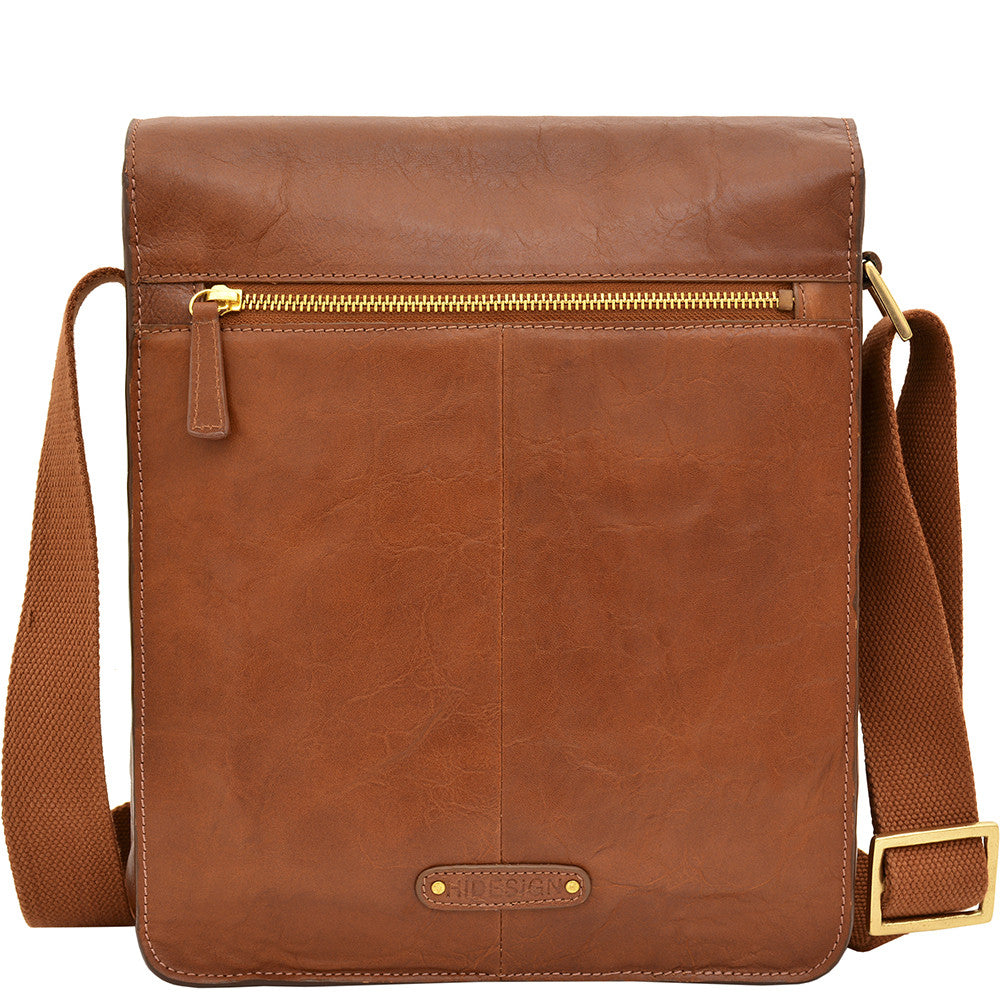 The Aiden Genuine Leather Mini Crossbody by Hidesign is a brown leather shoulder bag featuring a flap cover and an adjustable fabric strap with a brass buckle.